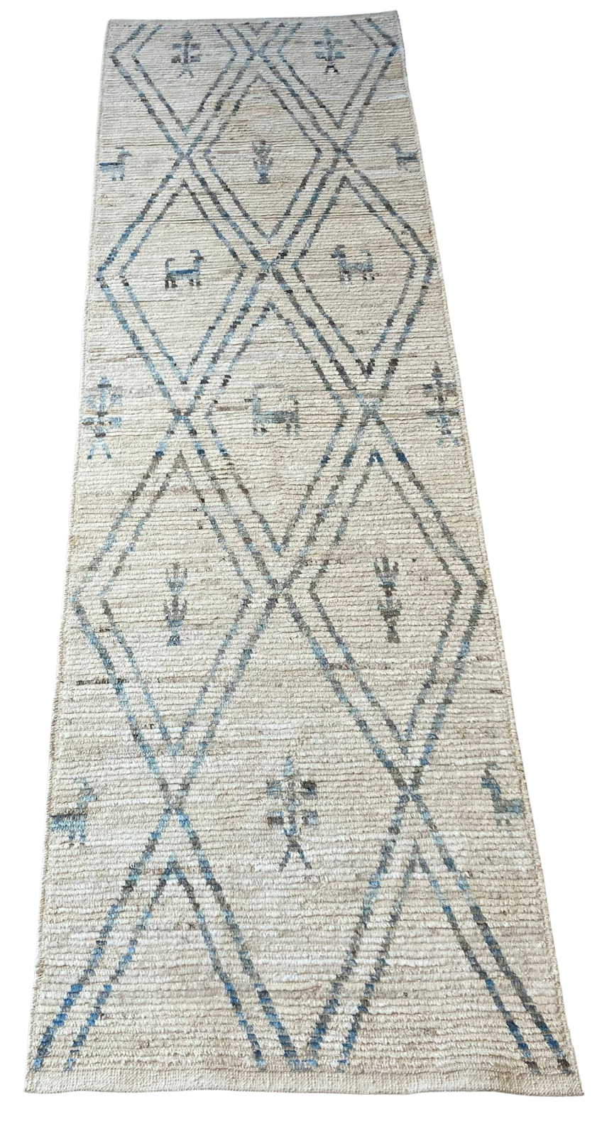 A rug with a geometric pattern on it is on a white background.