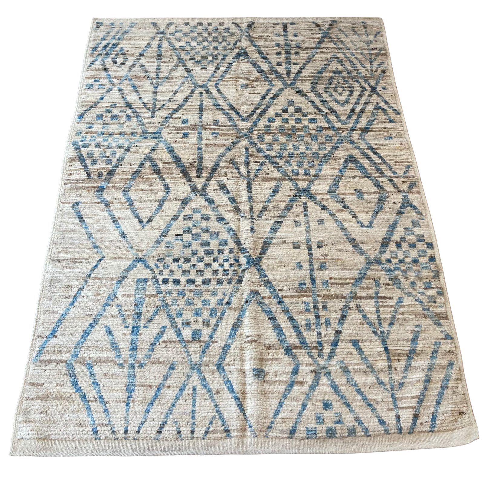 A rug with a blue and white pattern on it