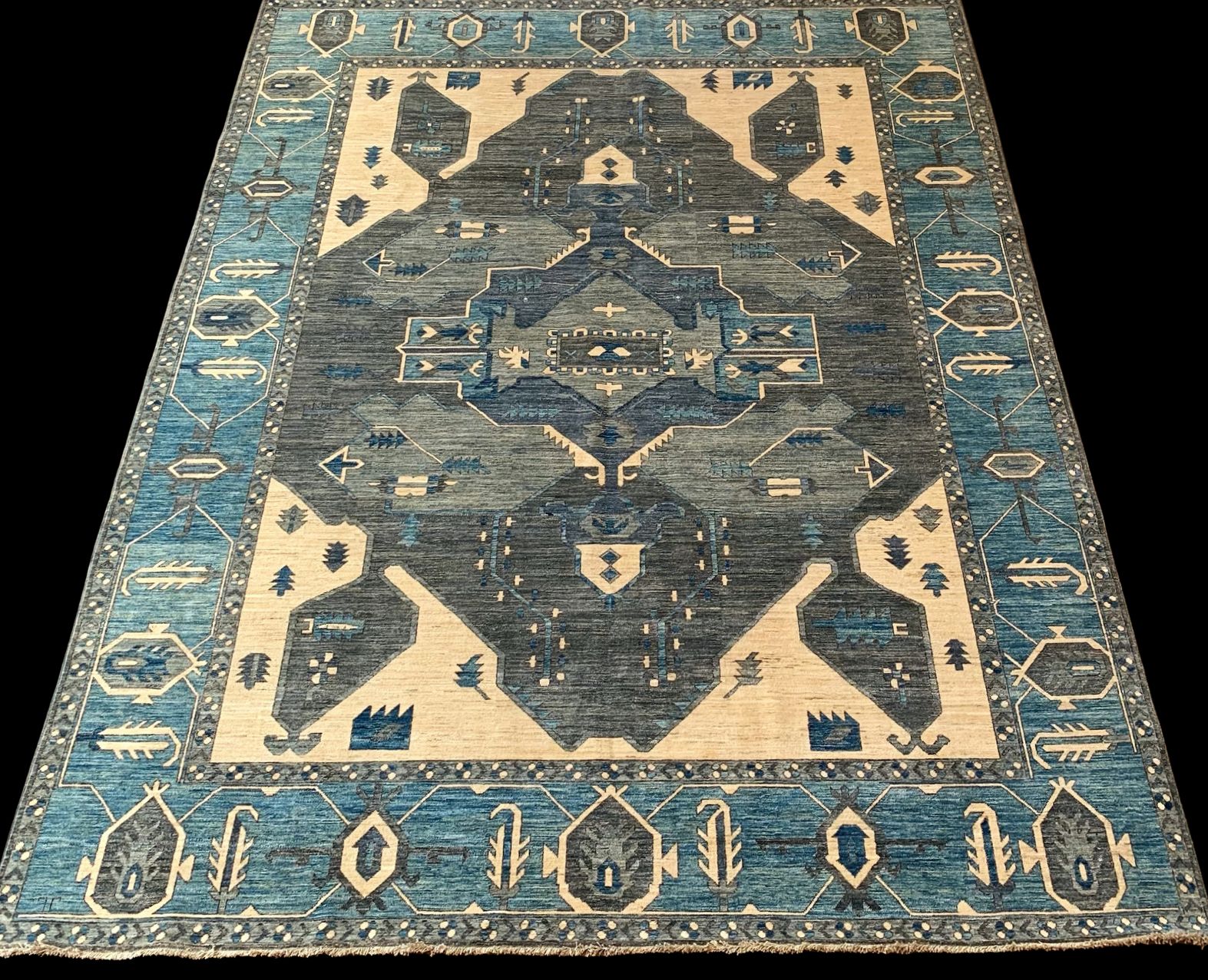 A blue and white rug with a geometric pattern on it