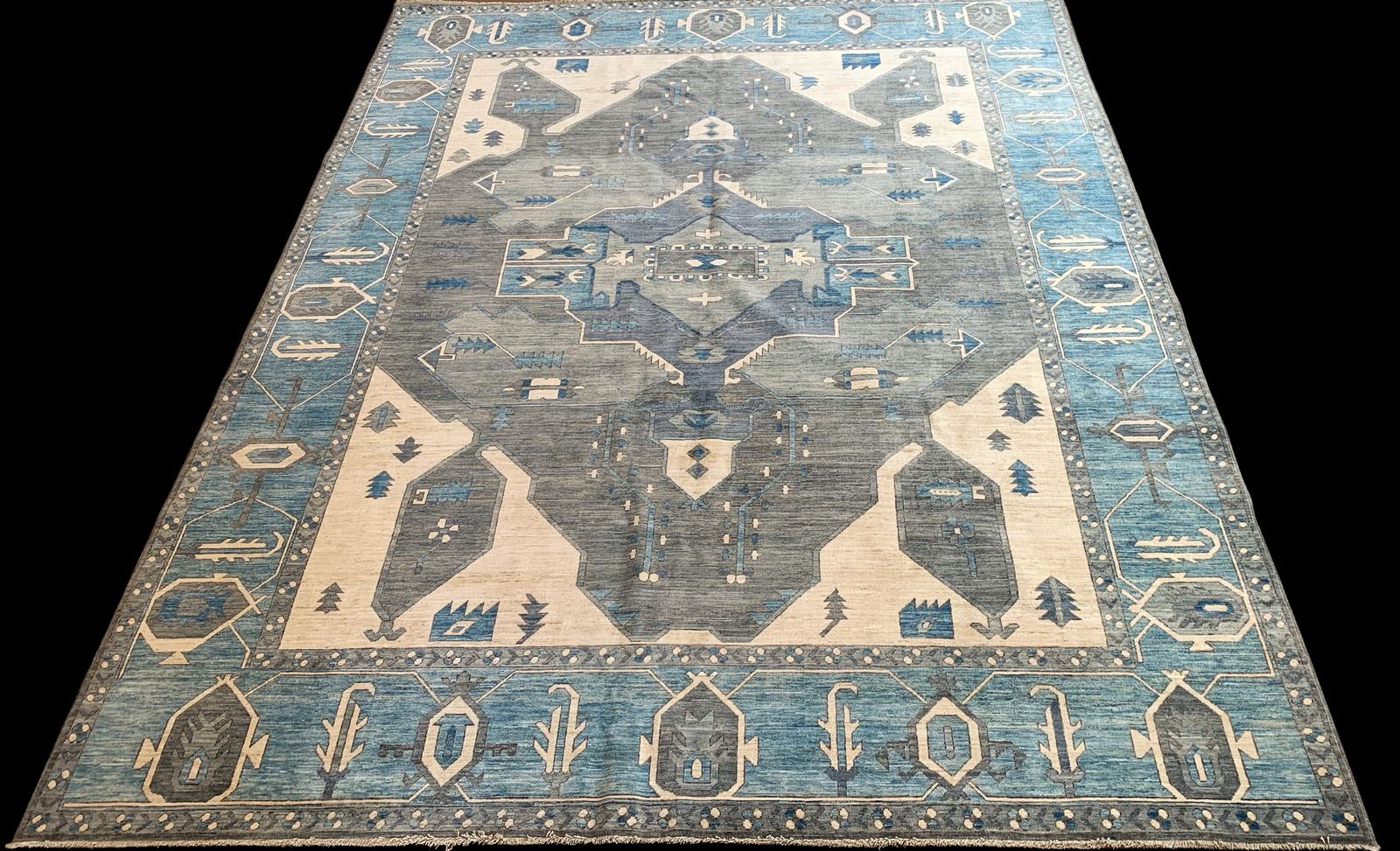 A blue and white rug with a geometric pattern on it