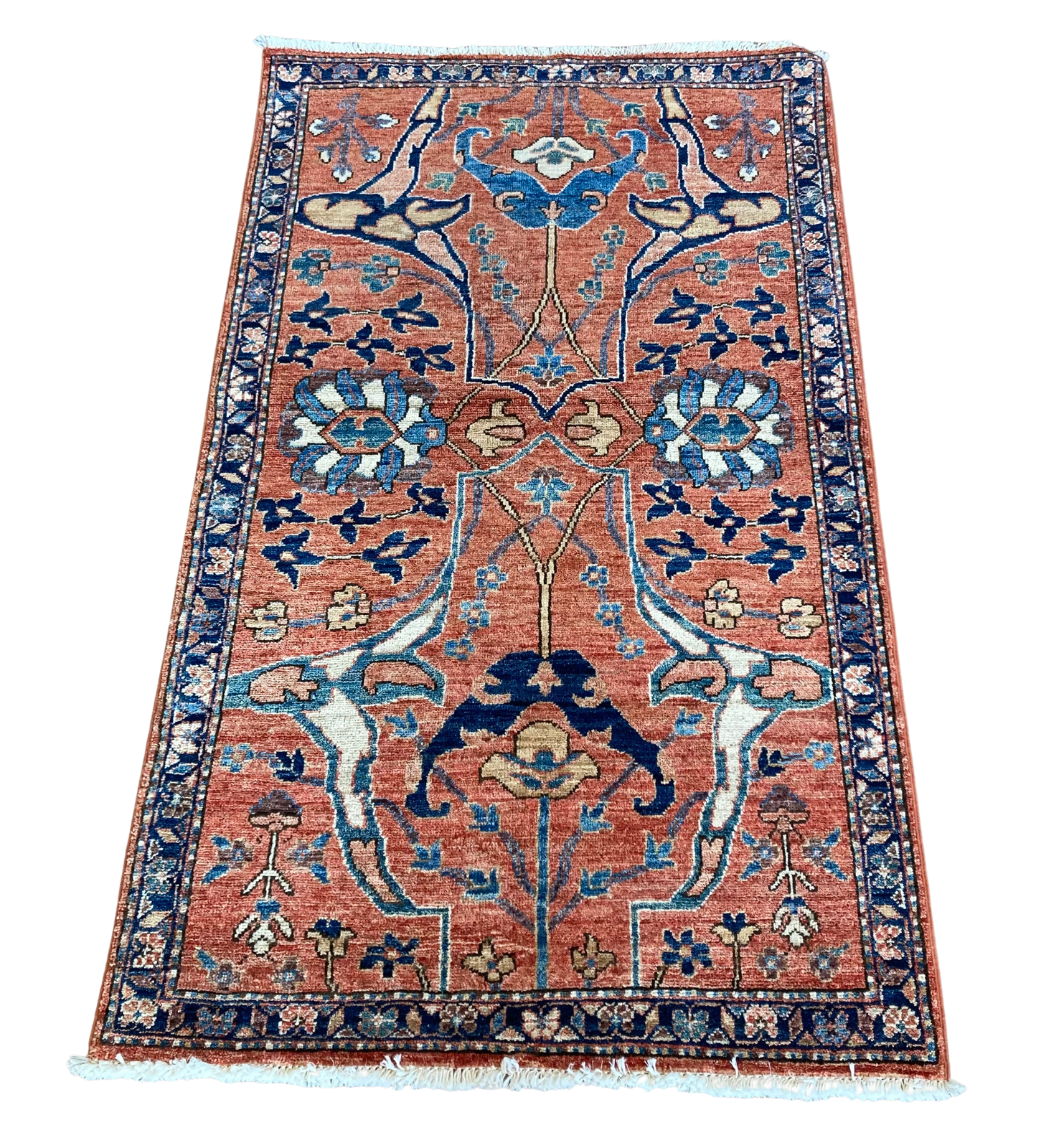 A rug with a floral pattern on it is on a white background