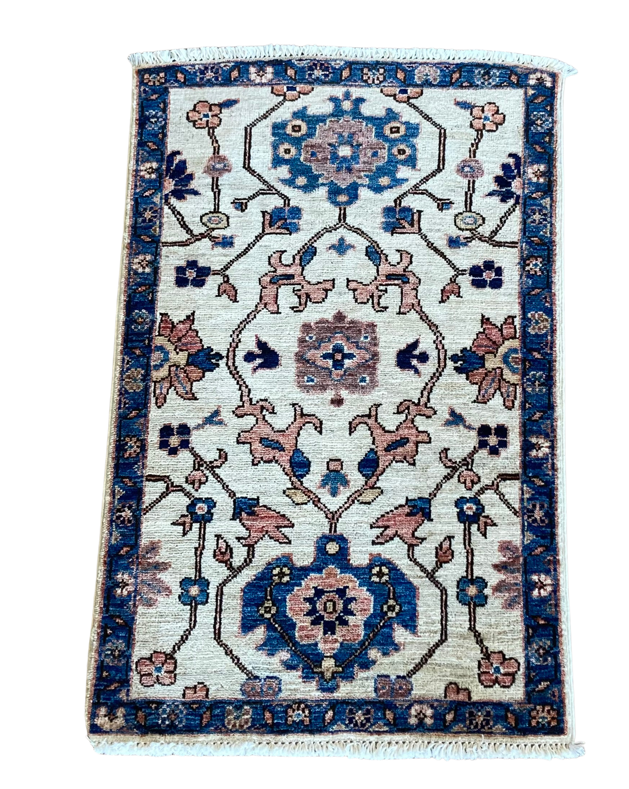A rug with a floral pattern on it is on a white background.