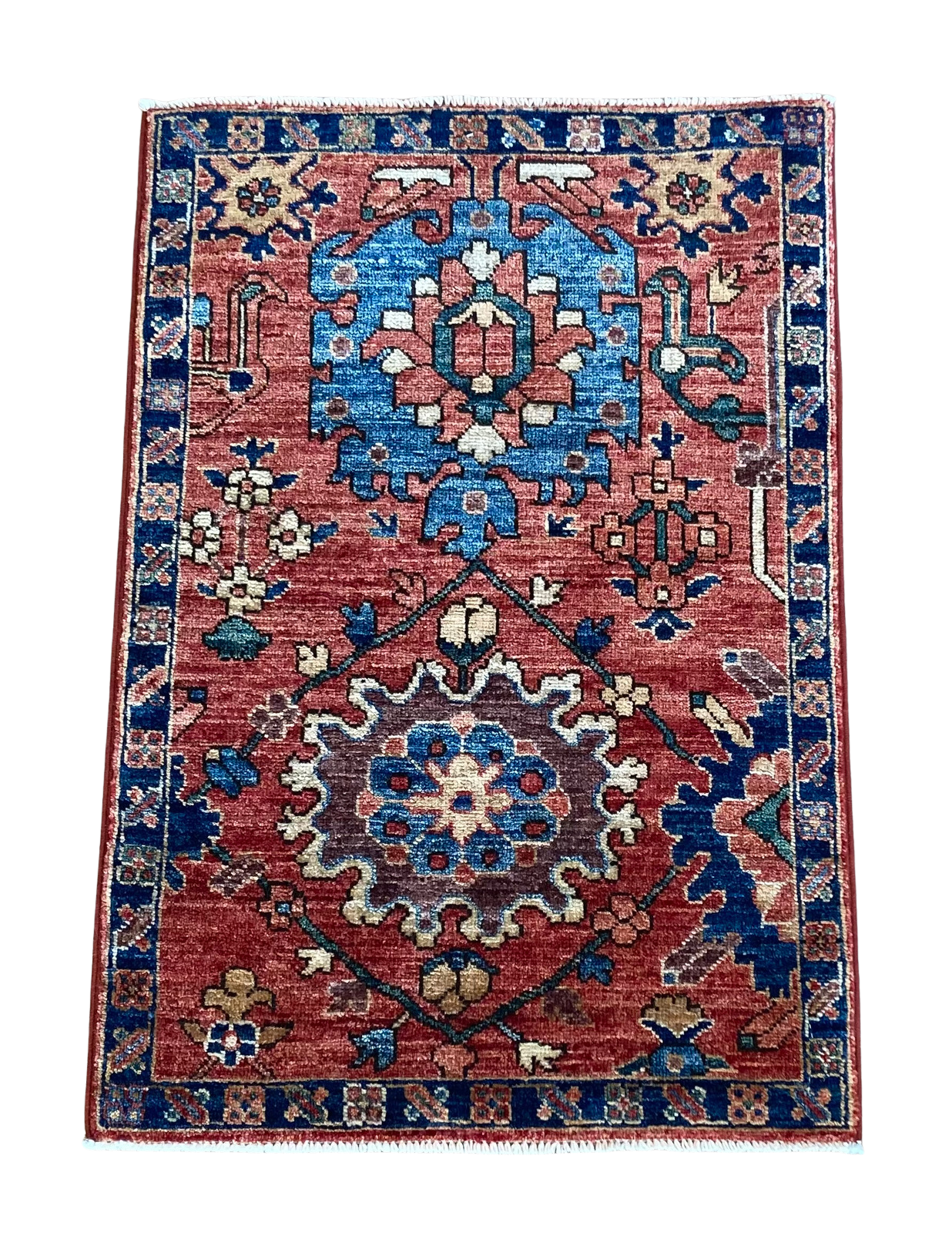 A red and blue rug with a floral pattern on it