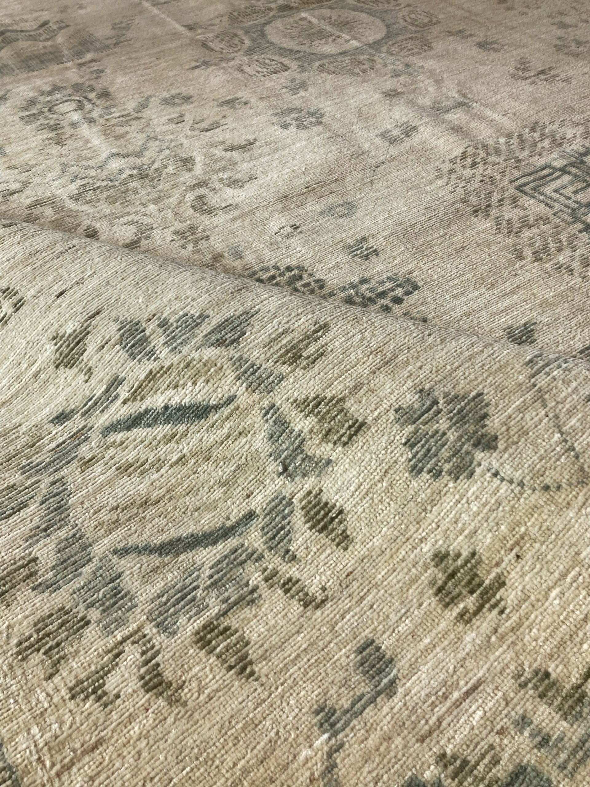 A close up of a rug with a floral pattern on it.