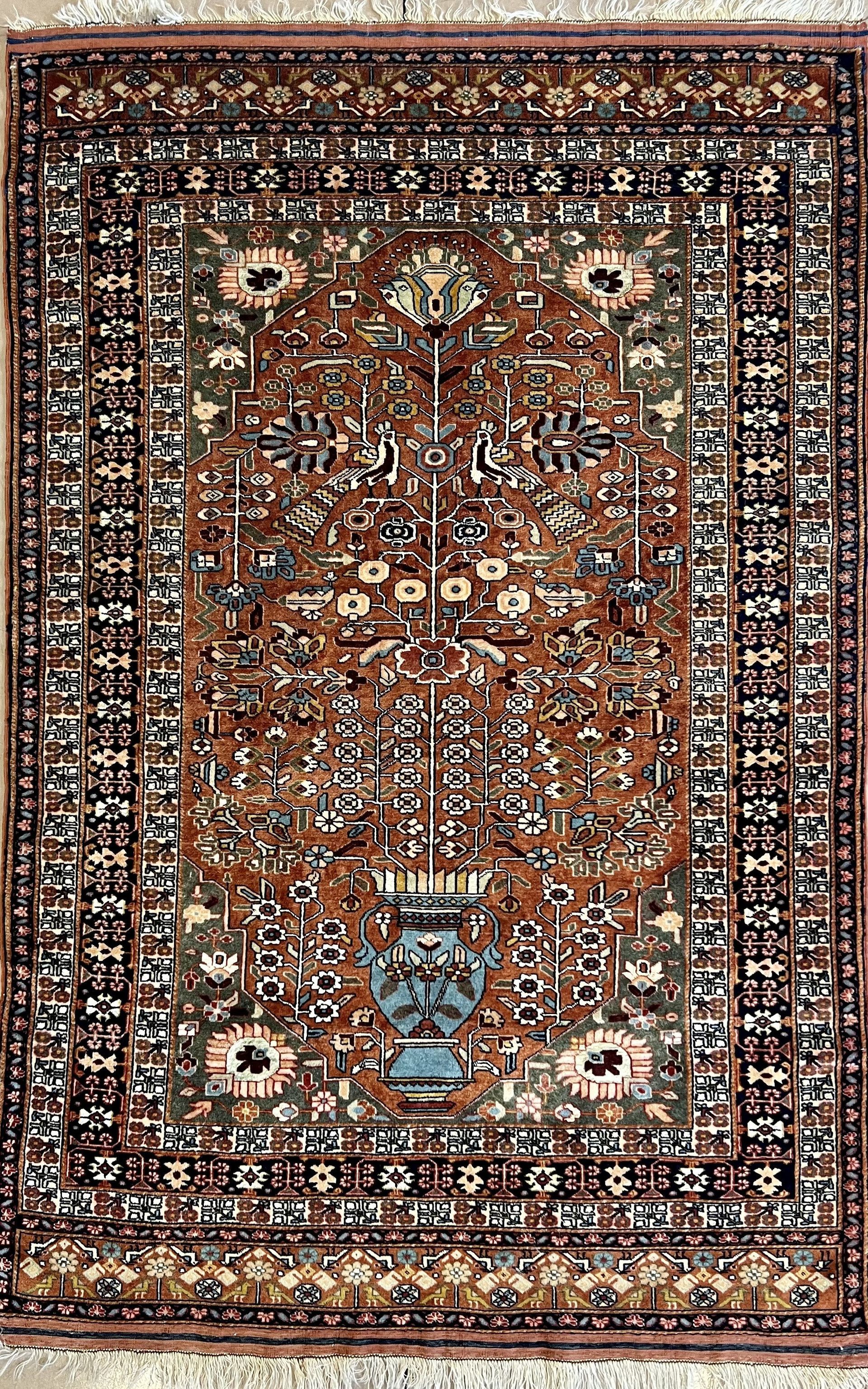 A close up of a rug with a floral pattern on it.