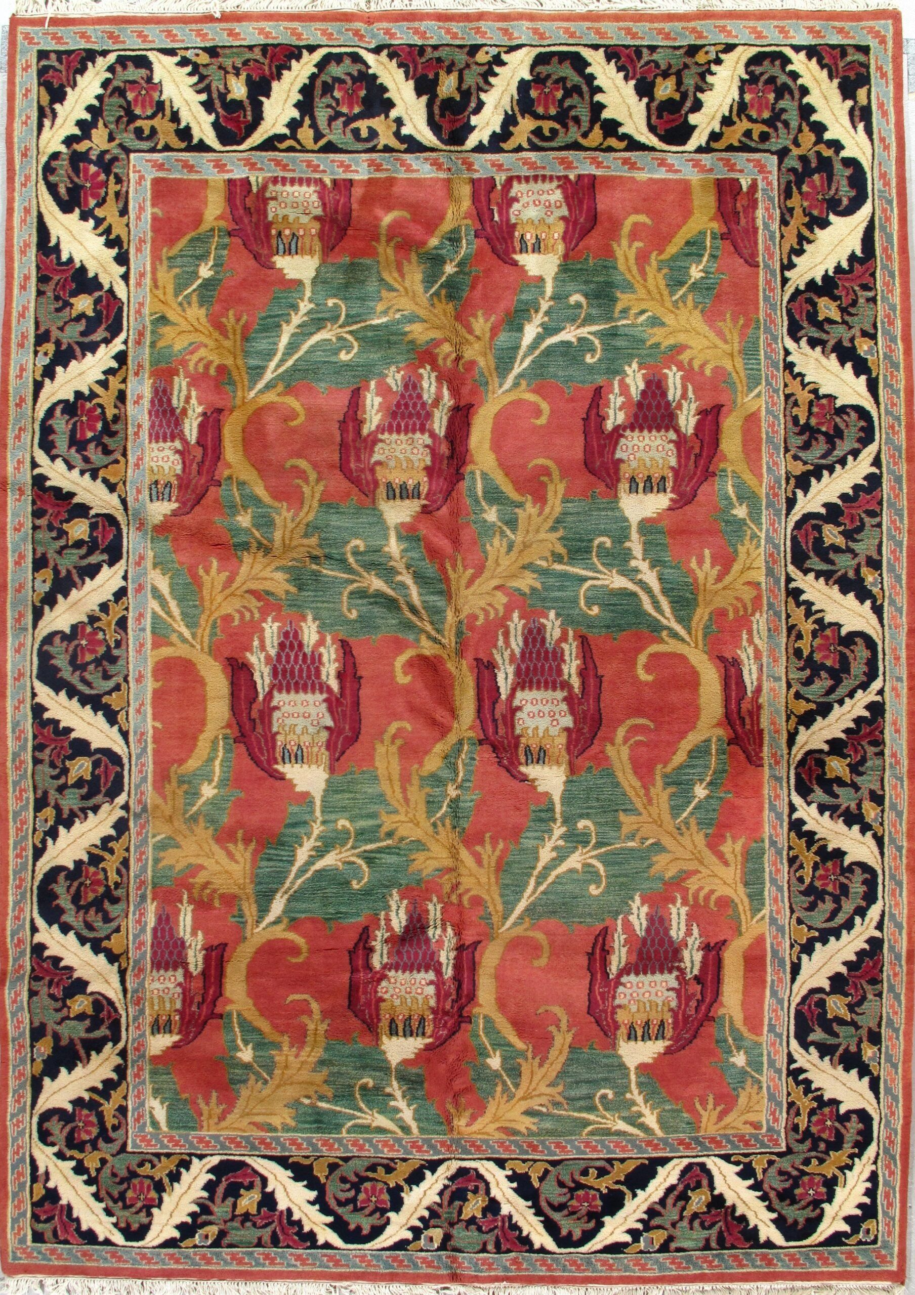 A rug with a pattern of flowers and leaves on it