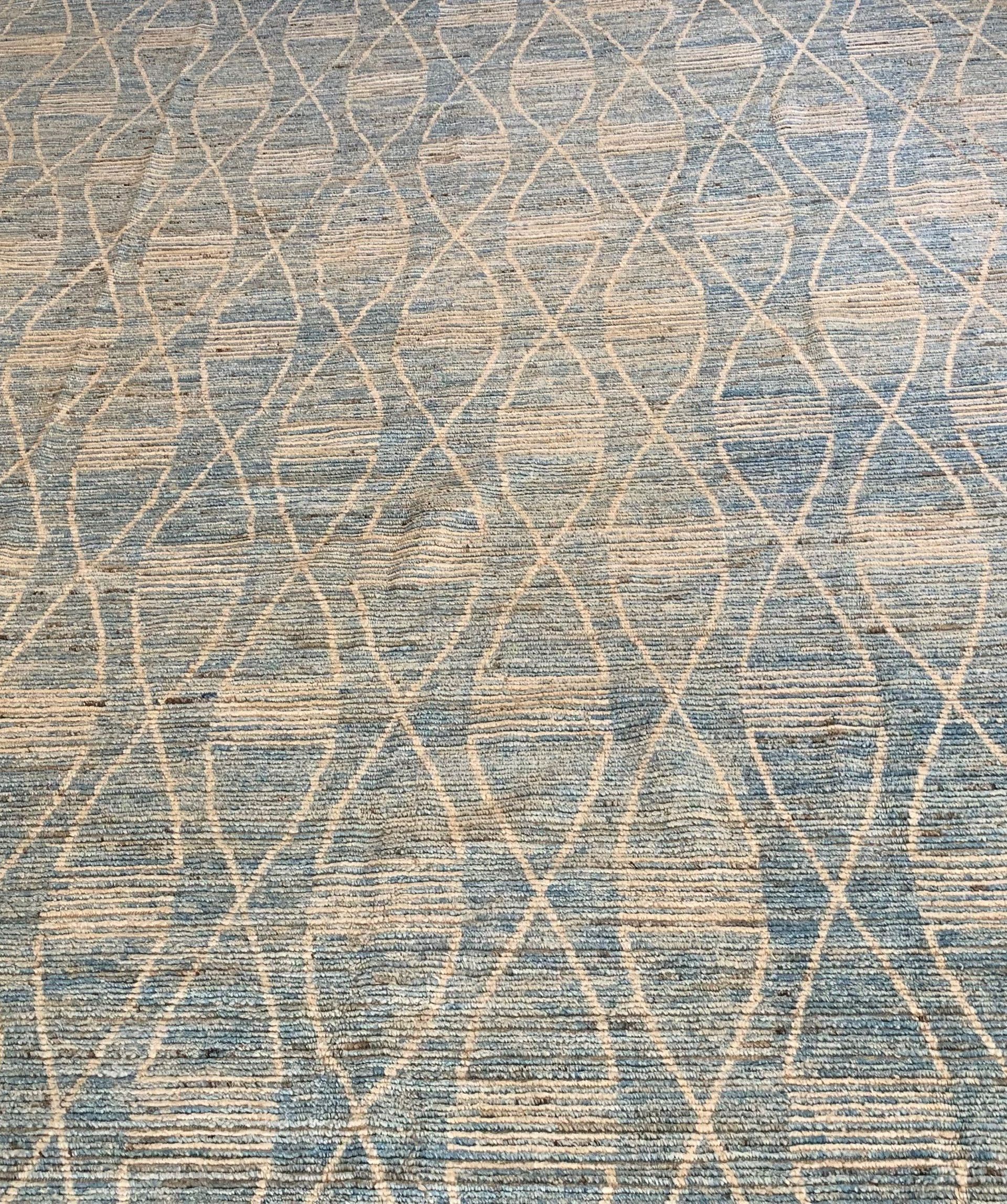 A close up of a rug with a pattern on it.