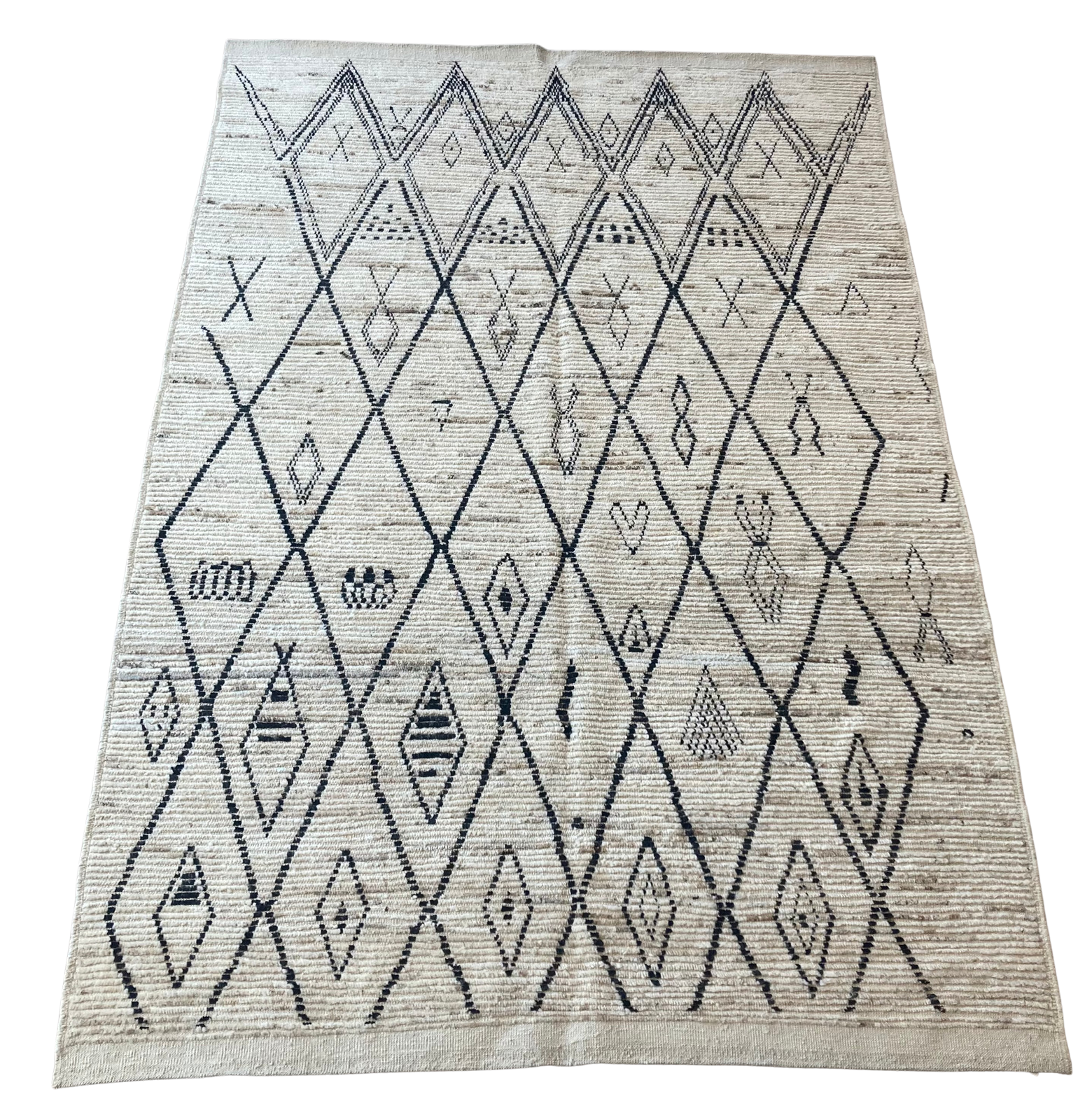 A rug with a black and white pattern on it