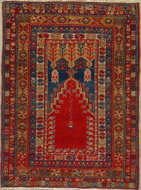 A rug with a red prayer mat on it