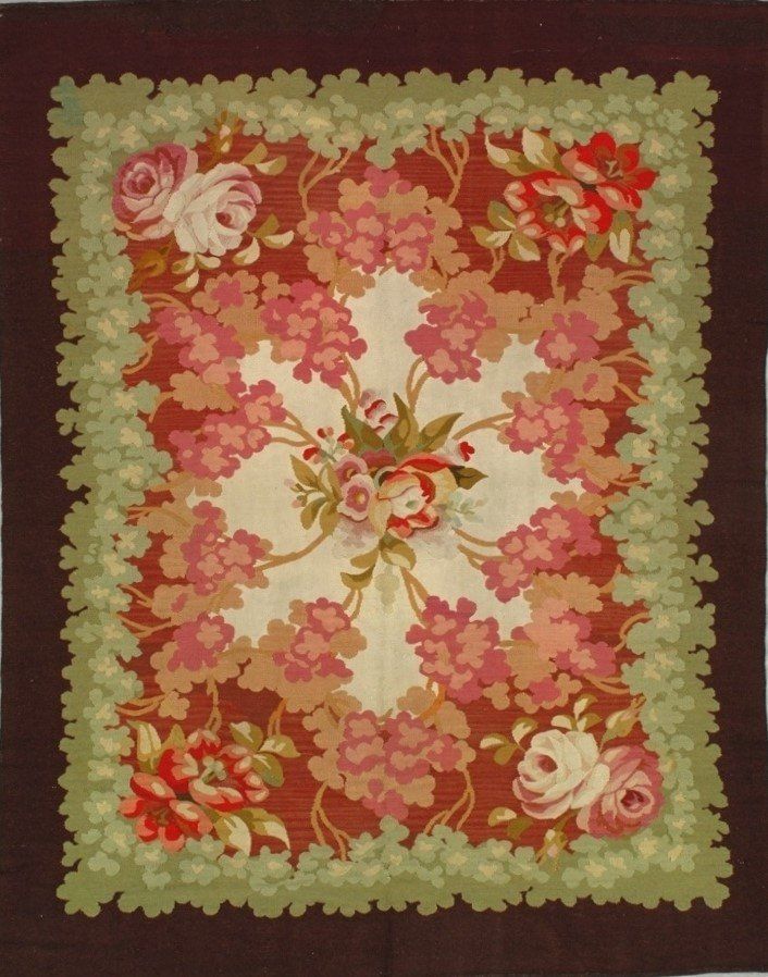 A rug with flowers and leaves on it