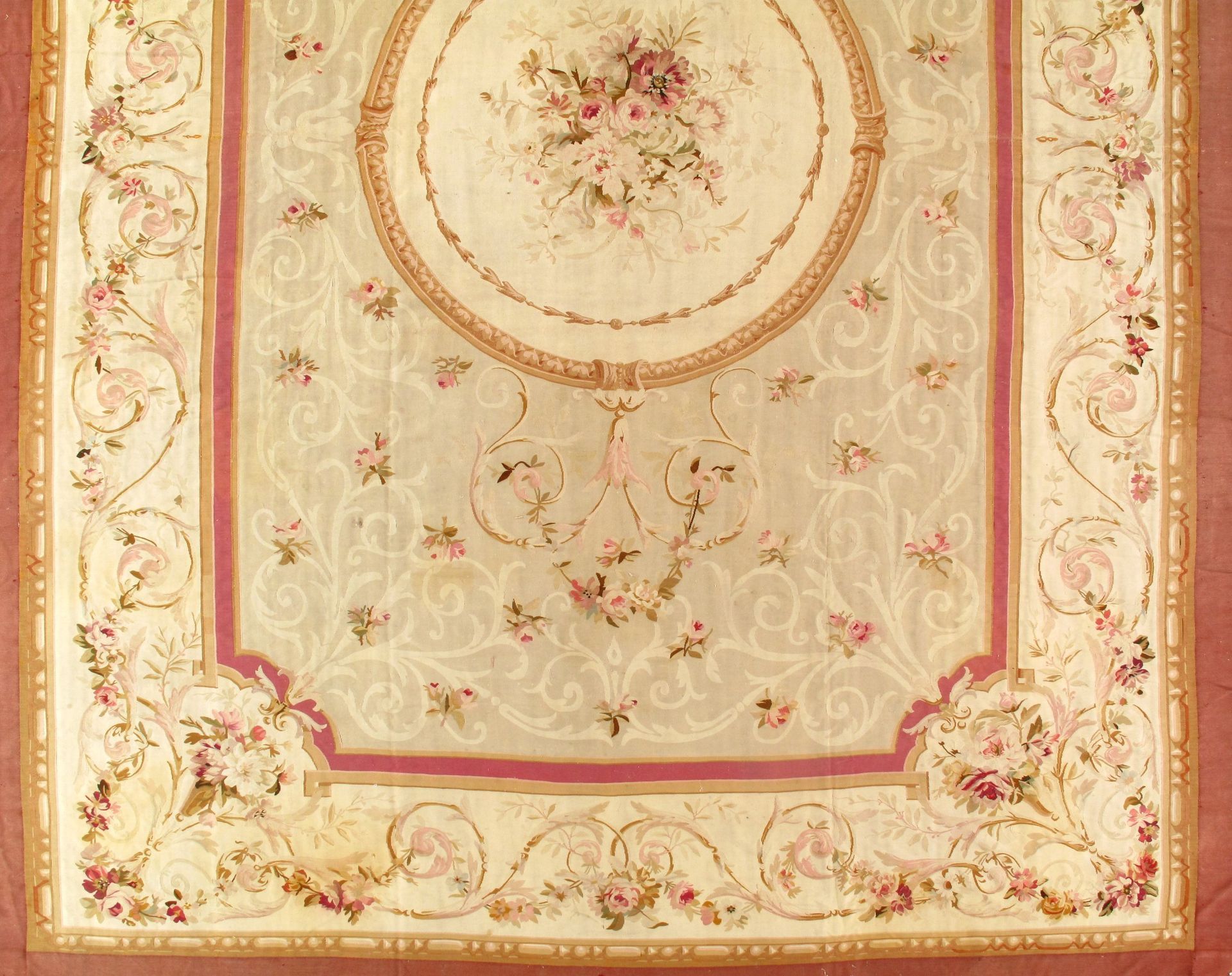 A rug with flowers and swirls on it