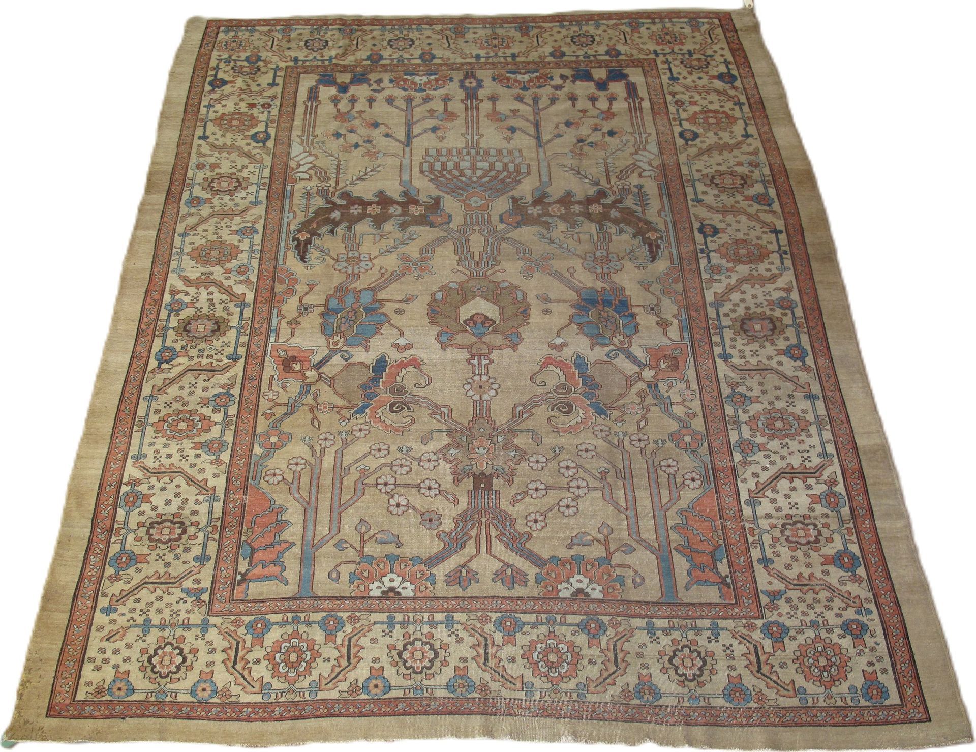 A rug with a tree and birds on it