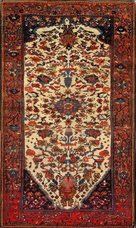 A rug with a tree of life design on it
