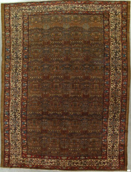 A rug with a floral pattern is hanging on a wall
