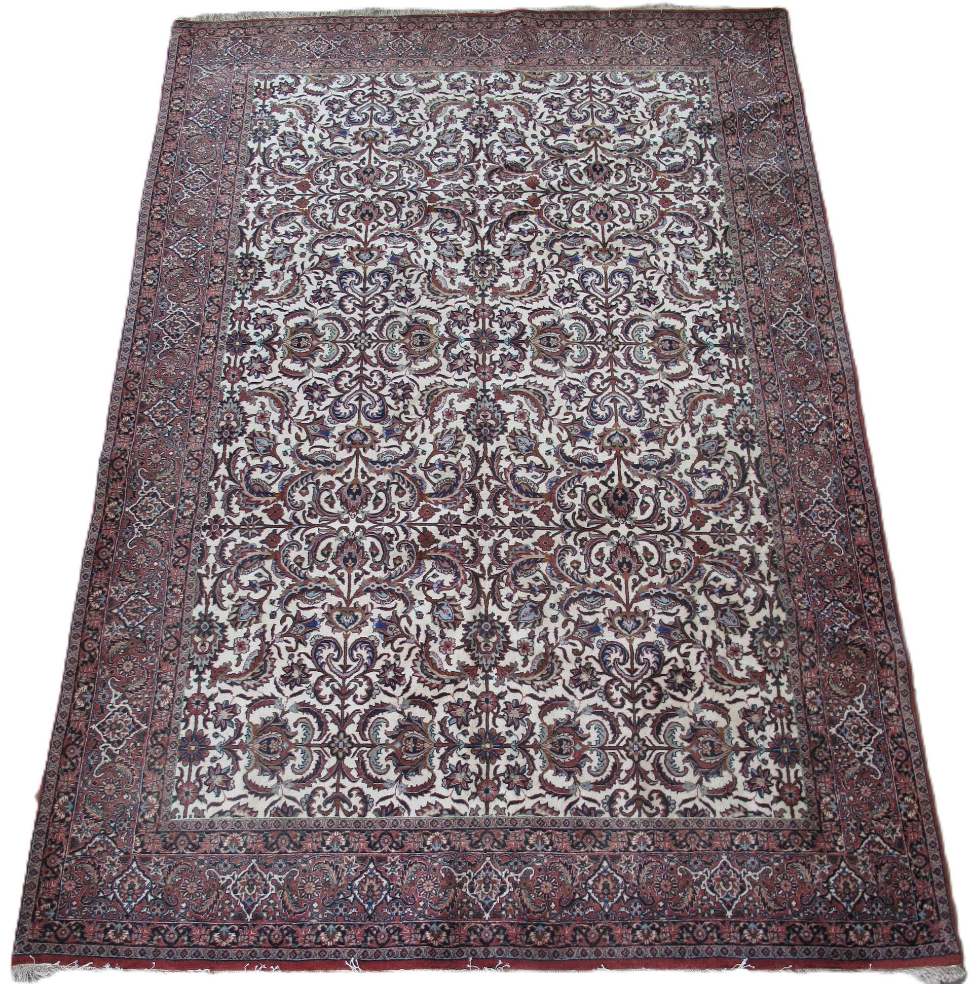 A rug with a pattern on it is sitting on a white surface.