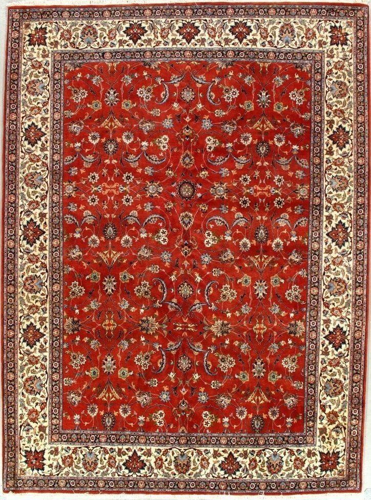 A red rug with a floral pattern on it