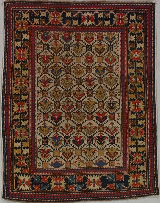 A rug with a geometric pattern and a border that says ' x ' on it