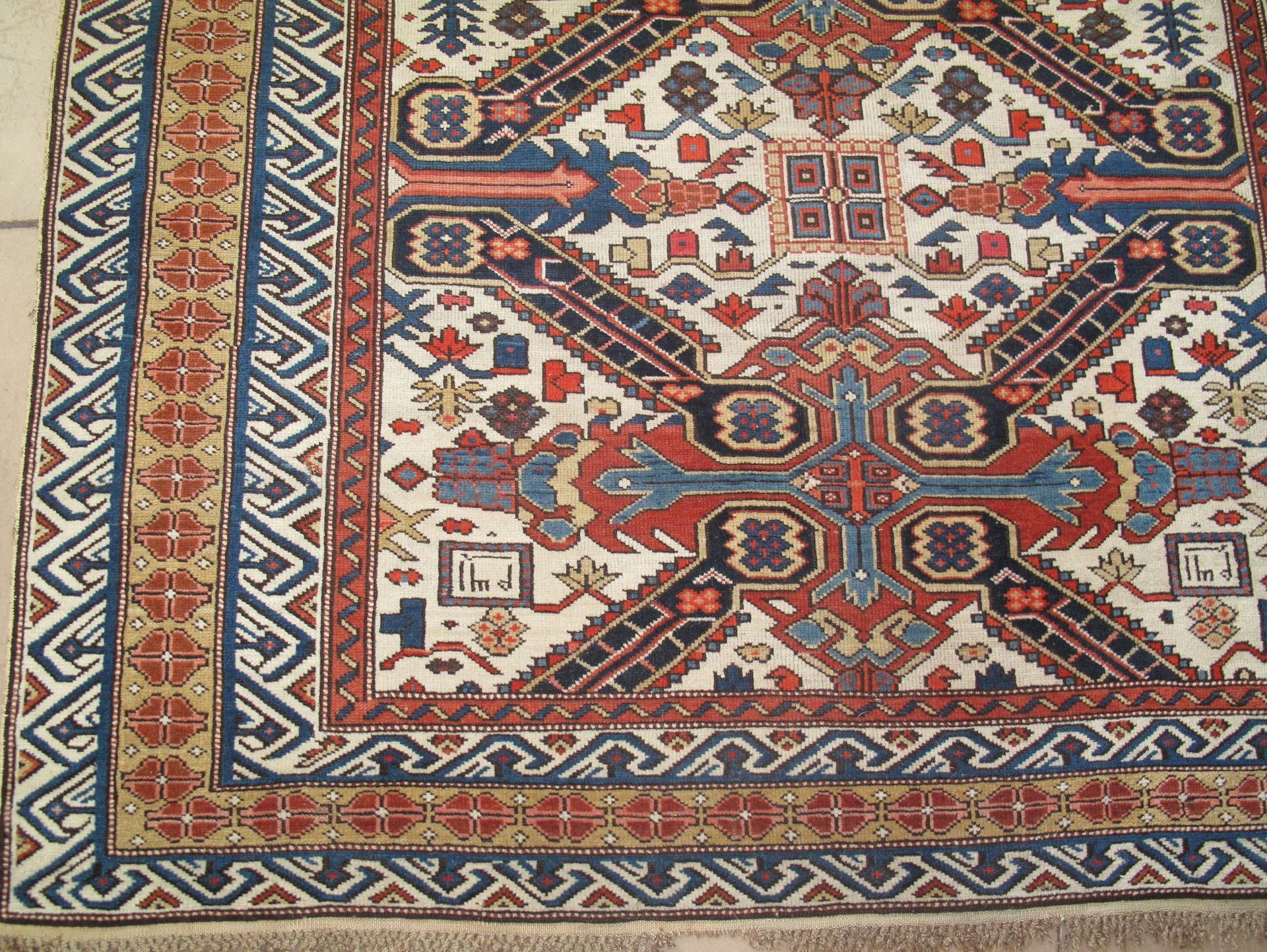 A rug with a pattern on it is on a white background.