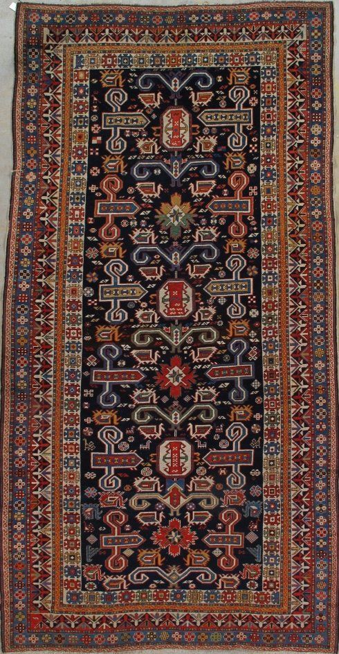 A rug with a floral pattern on it is sitting on a table.