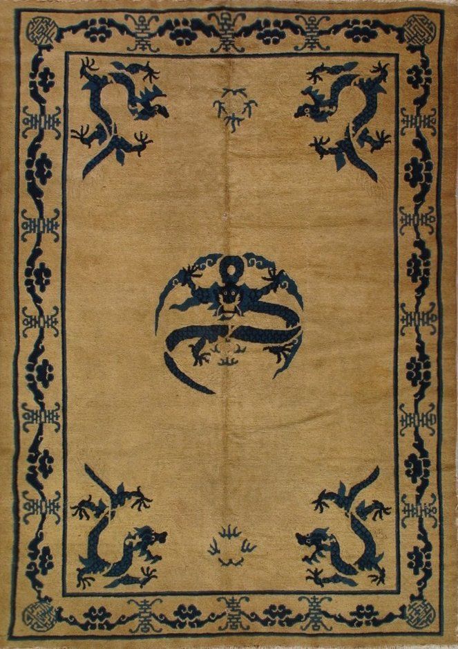 A rug with dragons and flowers on it