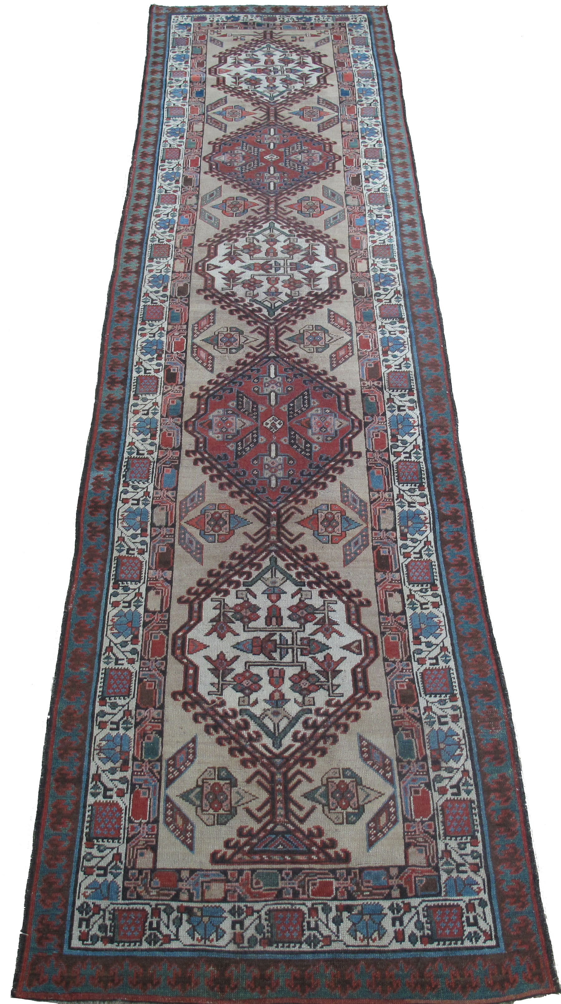 A long rug with a pattern on it is on a white background.