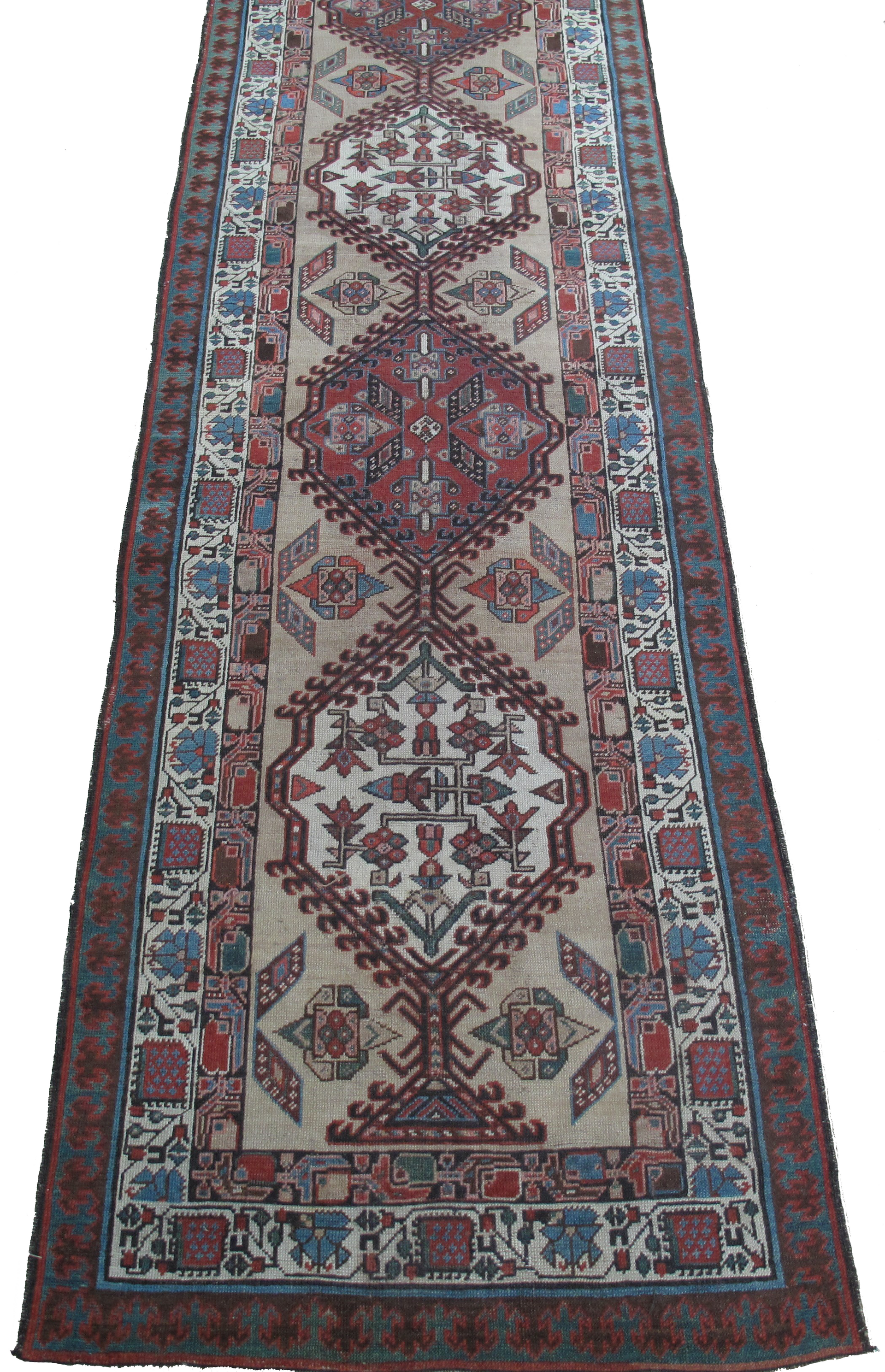 A long rug with a pattern on it is on a white background.