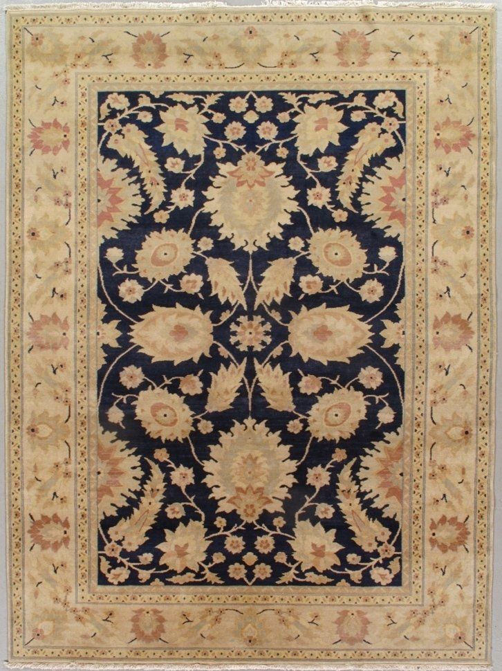 A rug with a blue and tan pattern on it