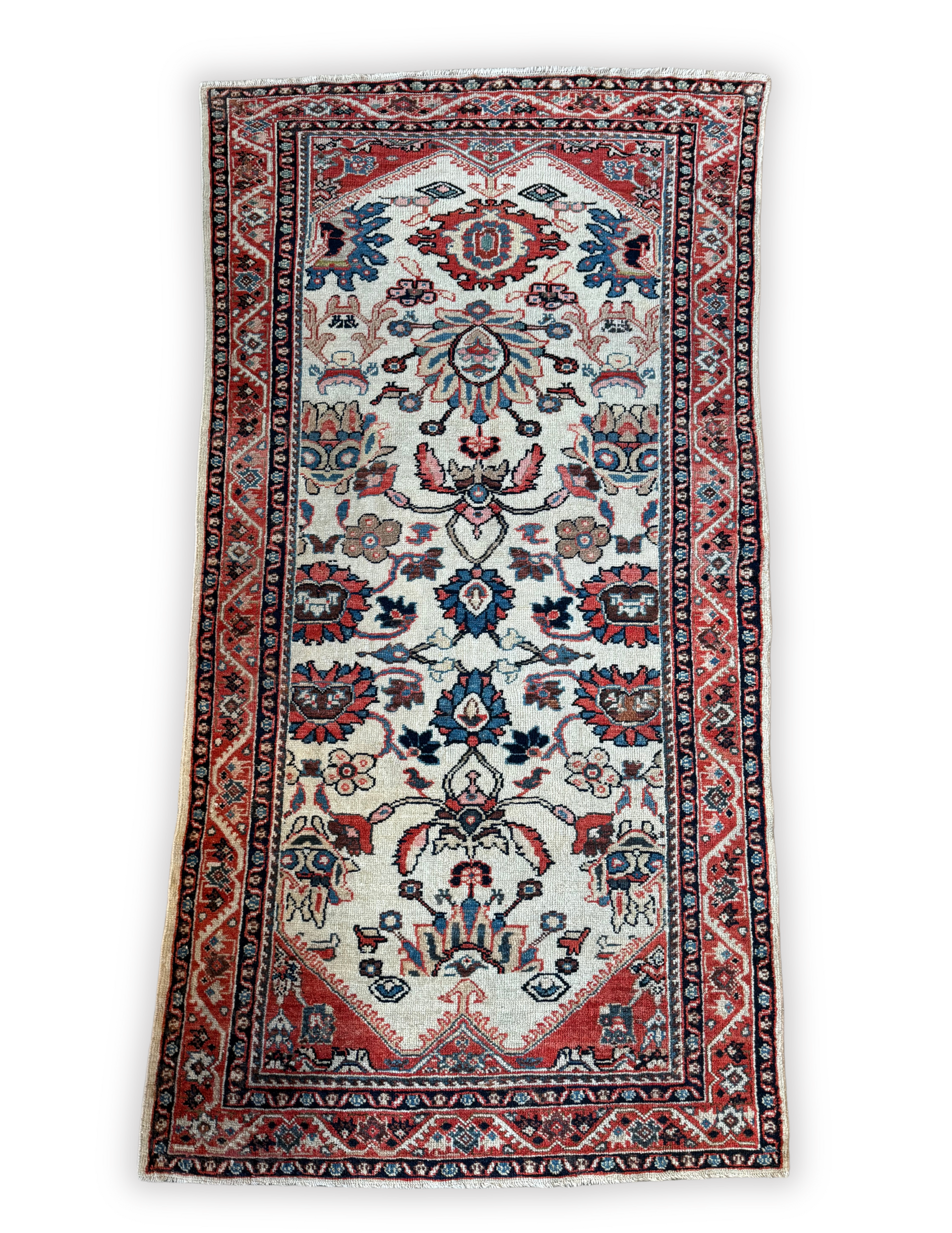 A rug with a floral pattern on it is on a white background.