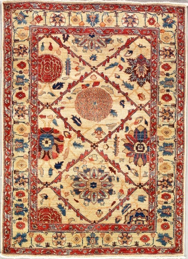 A rug with a floral pattern on it is on a white background.