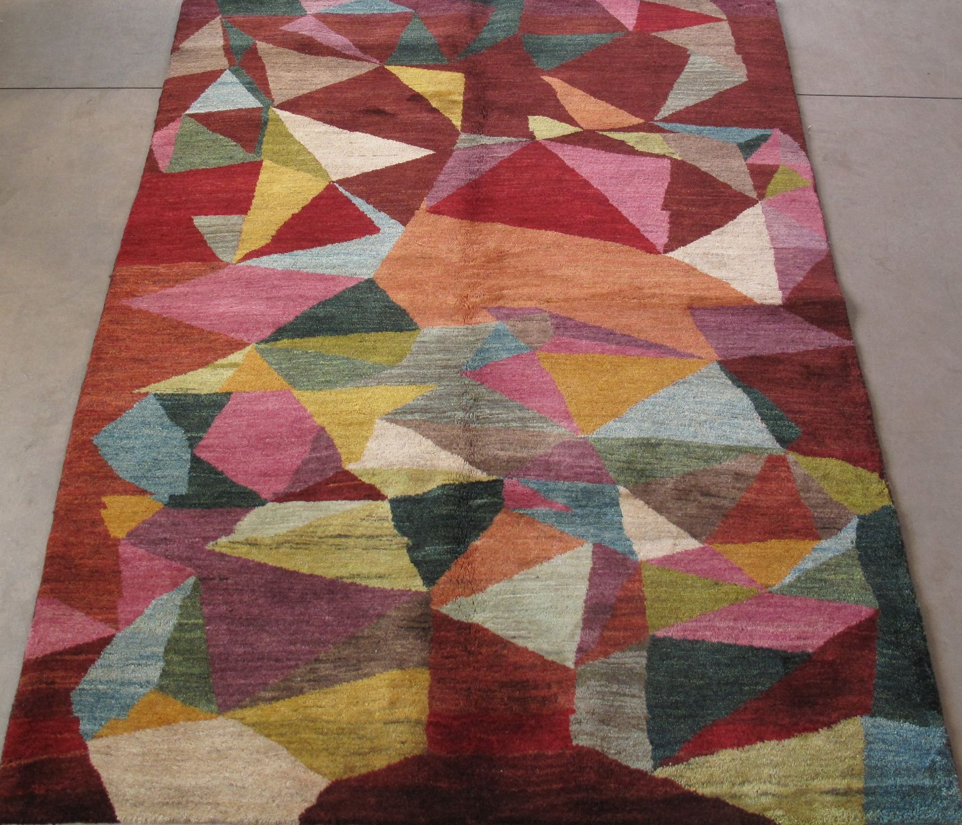 A colorful rug with a geometric pattern on it