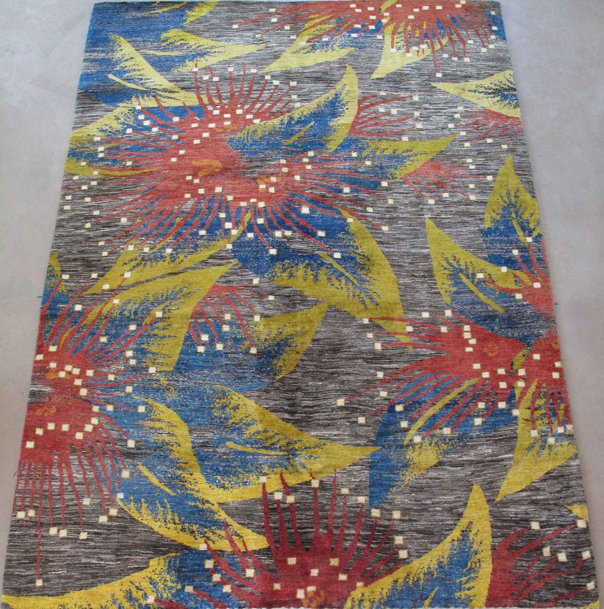 A colorful rug with leaves and stars on it
