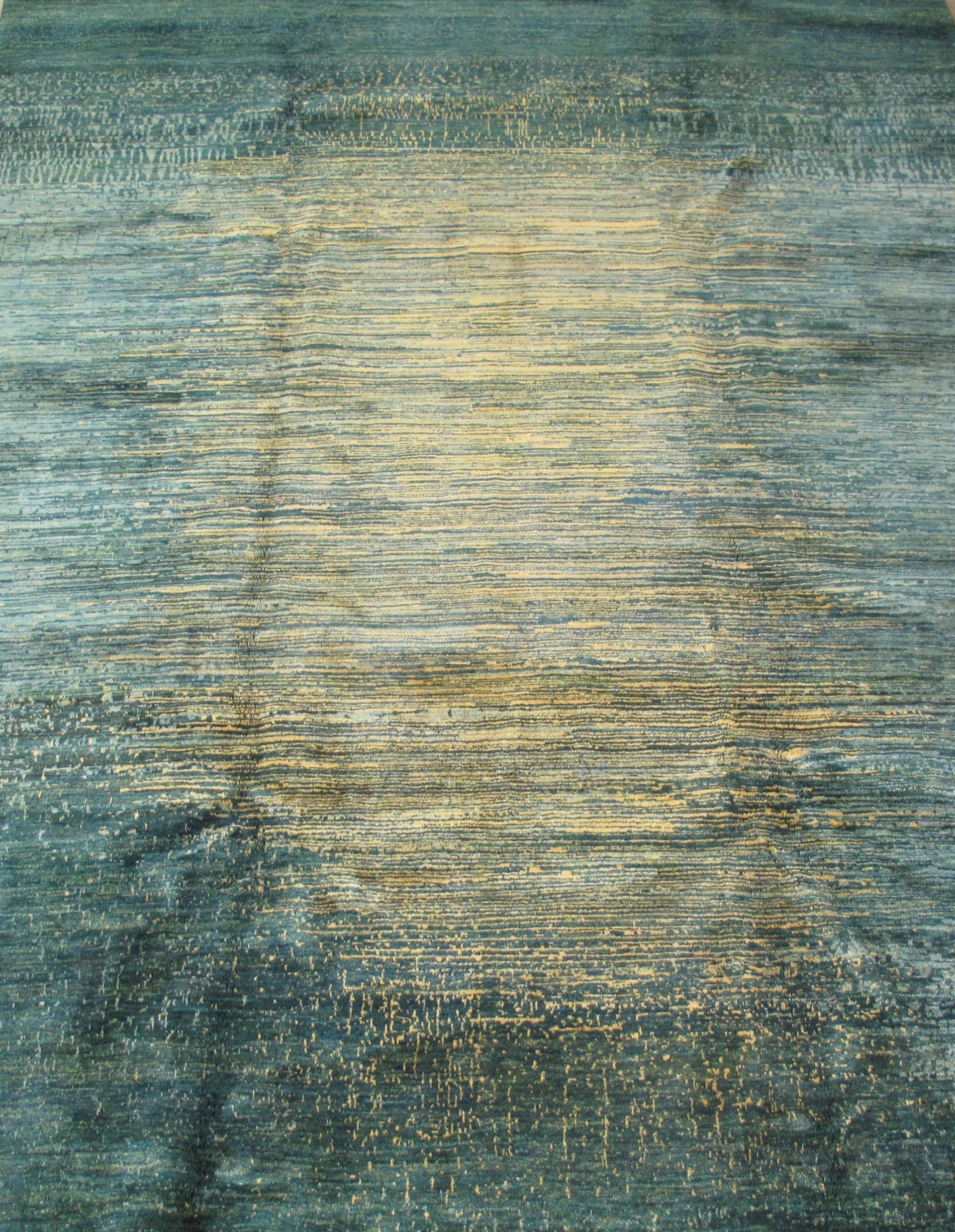 A green and gold rug is laying on the floor