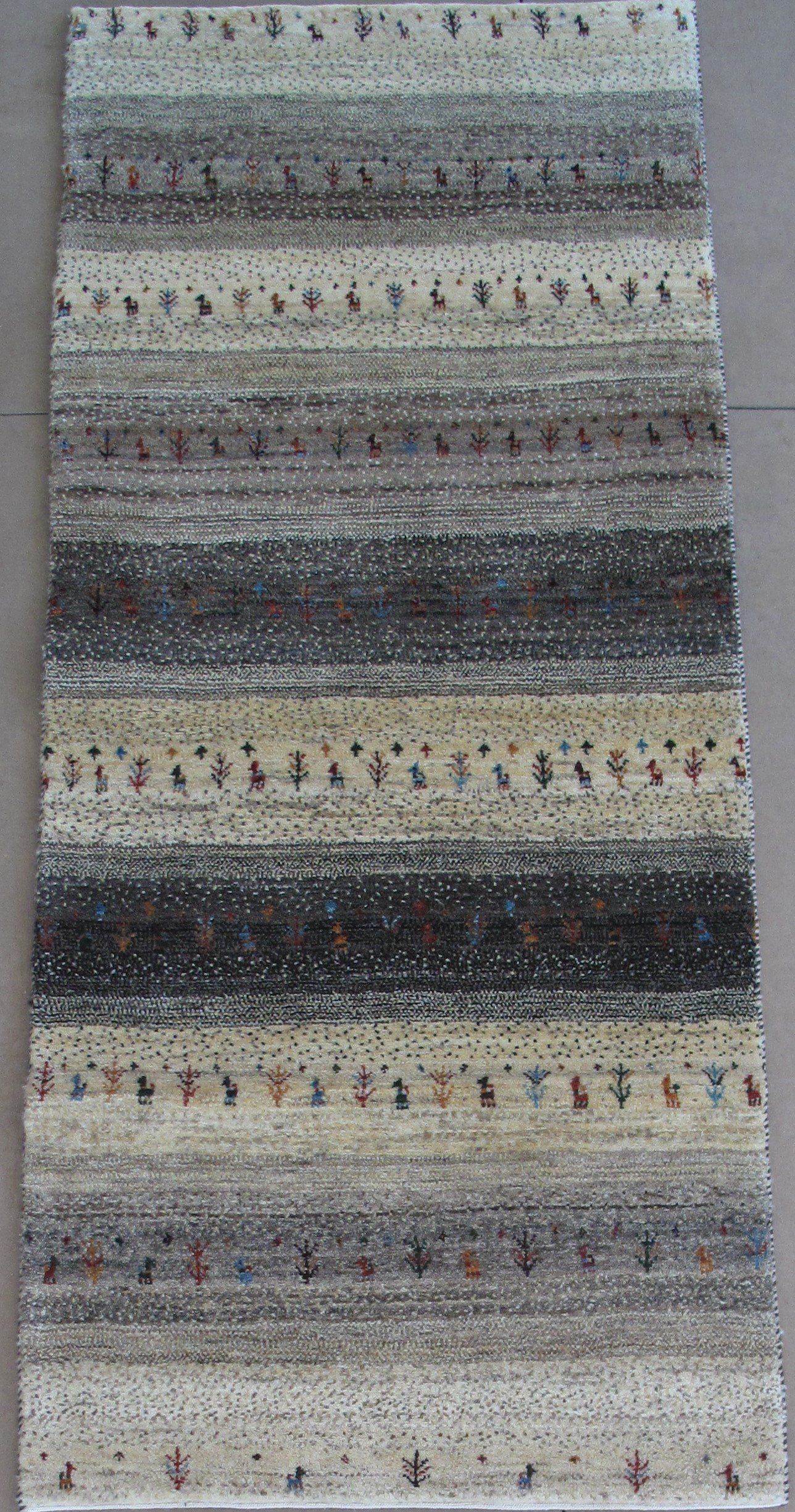 A rug with a striped pattern is sitting on a table.