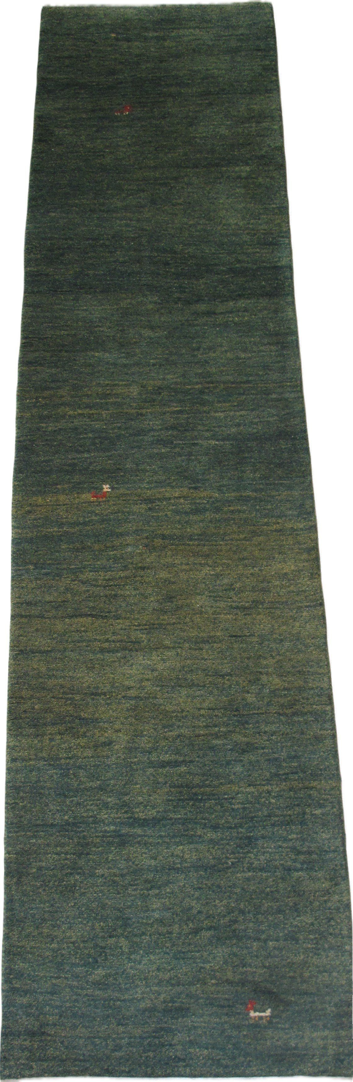 A green rug is sitting on top of a white surface.