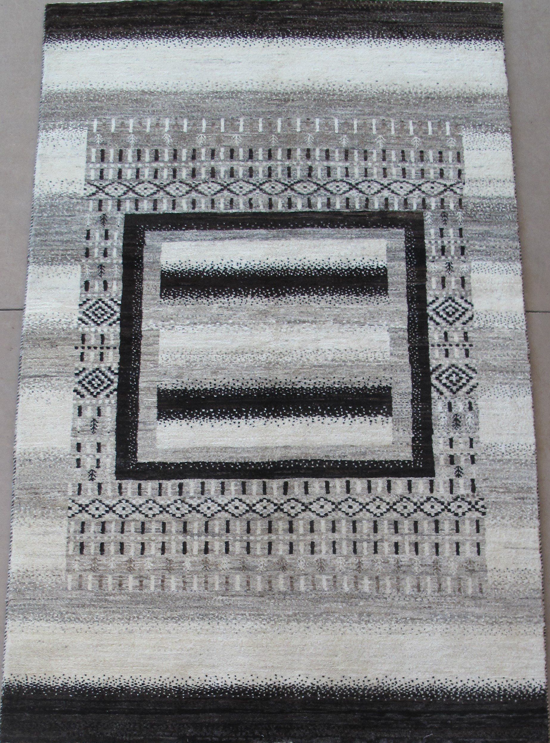 A black and white rug with a square in the middle