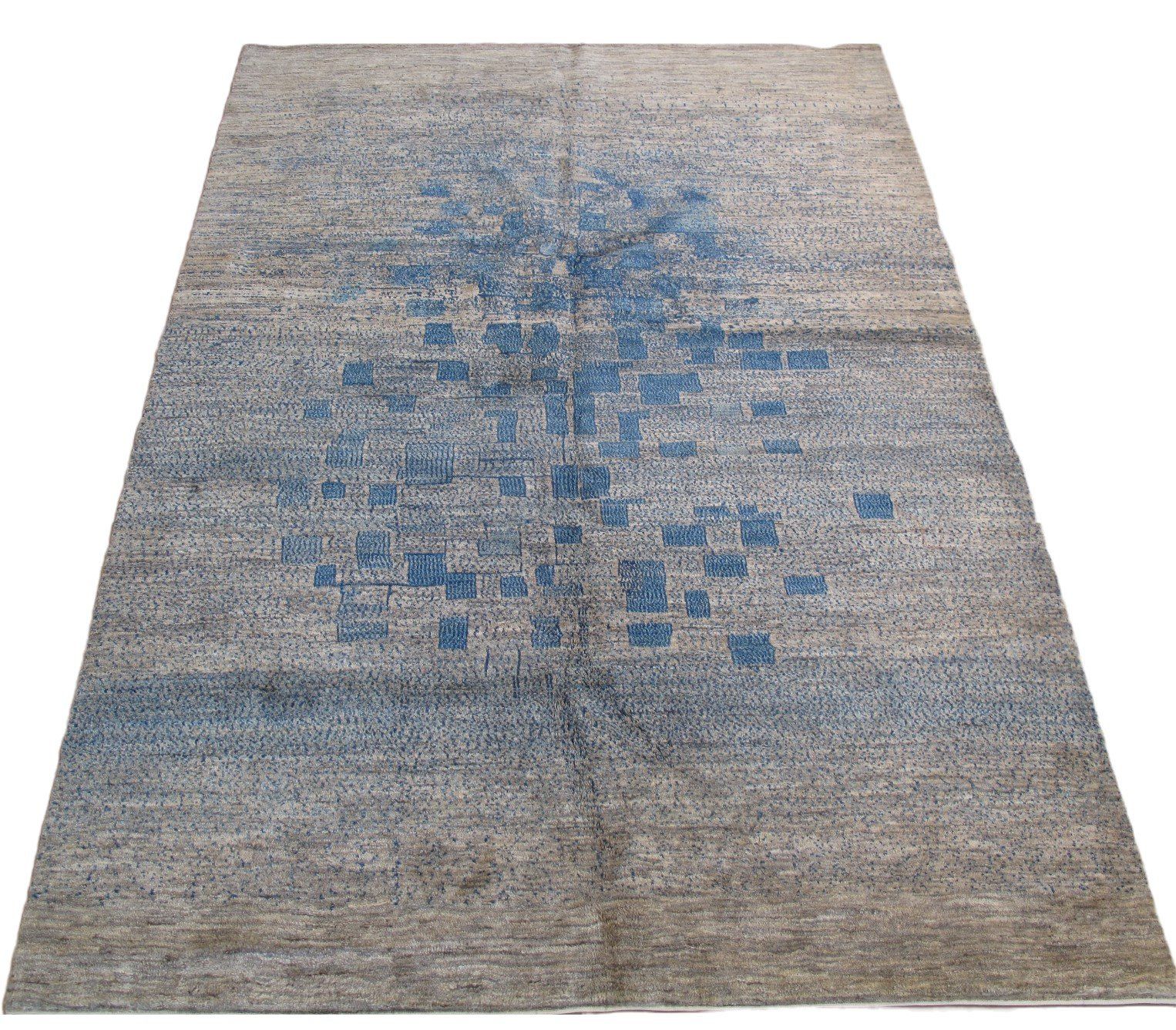 A rug with a blue pattern on it on a white background