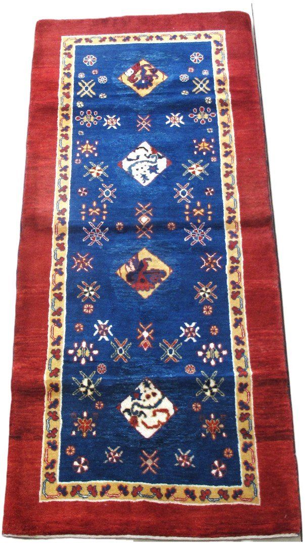 A blue and red rug with a pattern on it