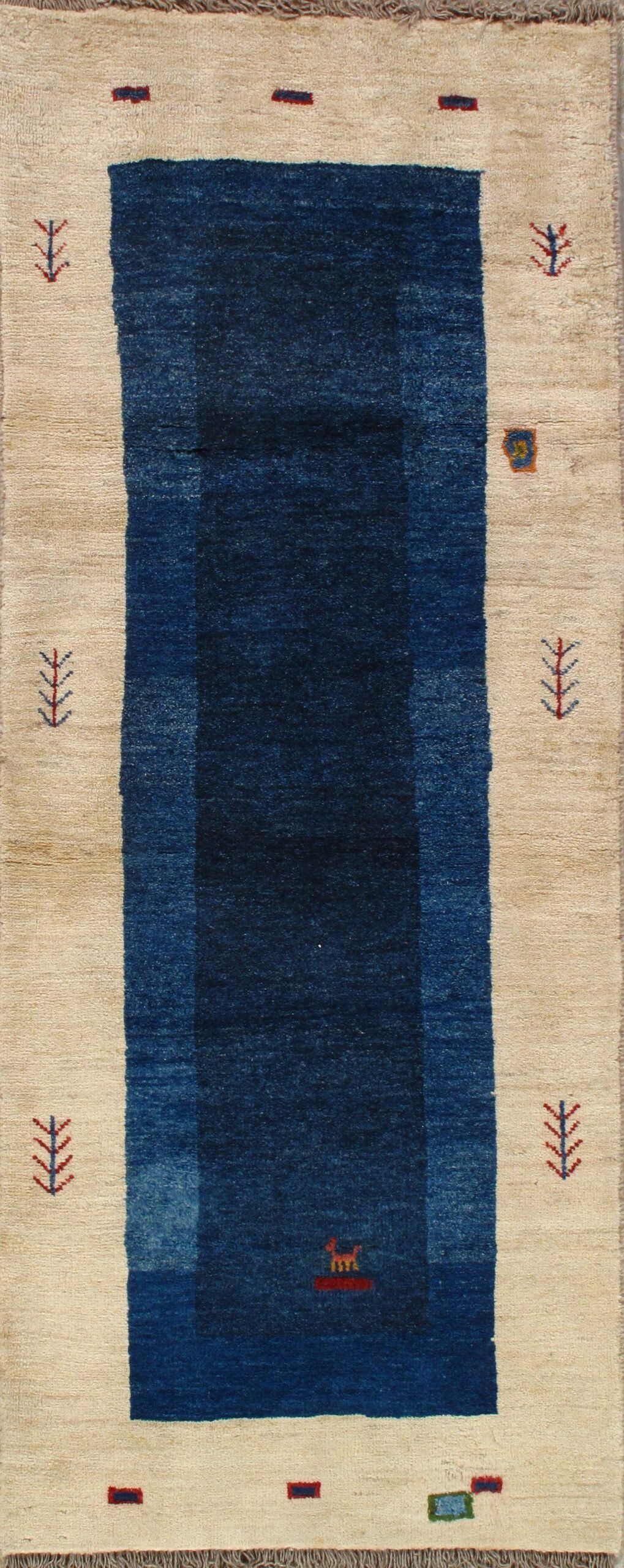 A blue rug with a white border is sitting on a table.