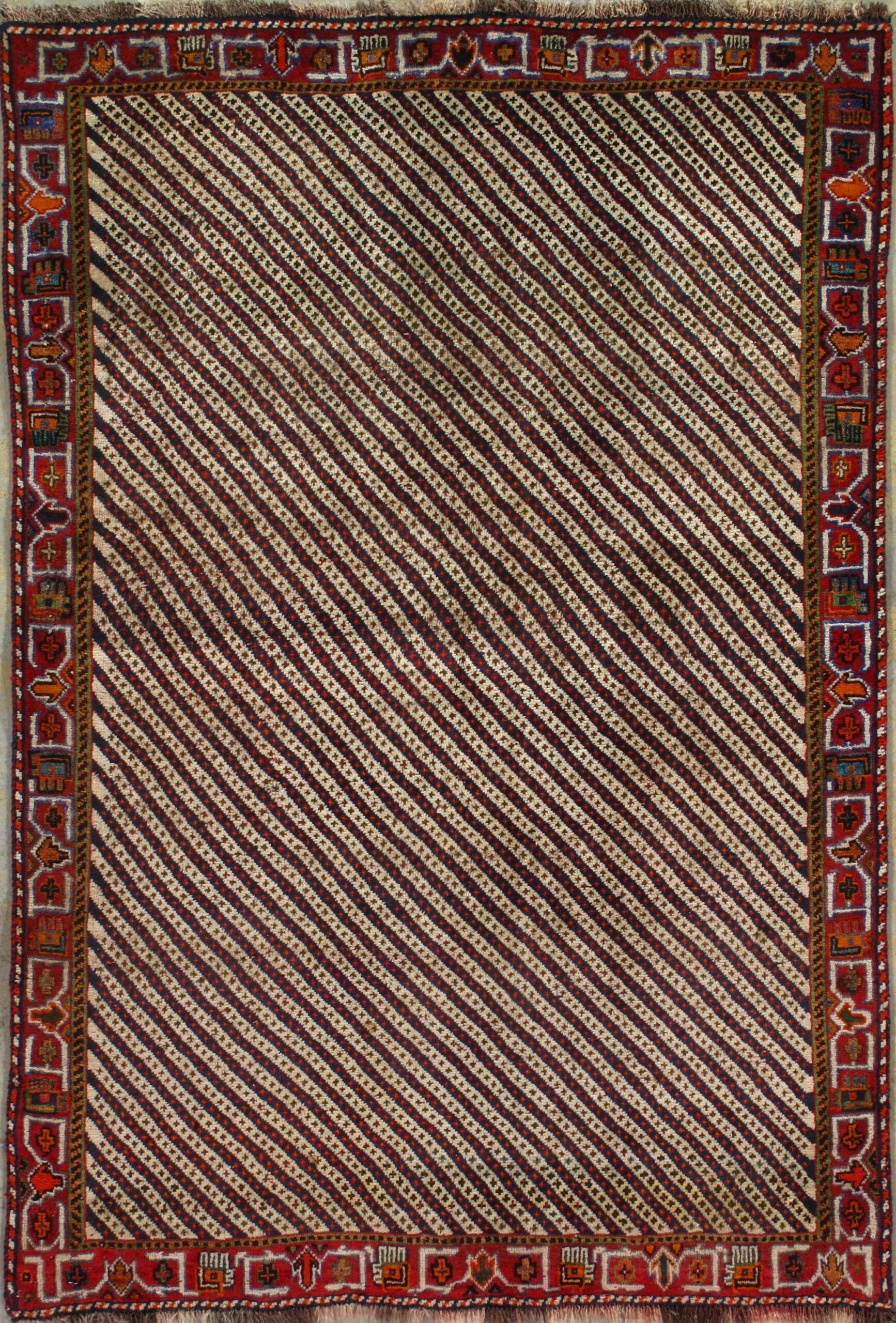 A rug with a diagonal striped pattern and a red border.