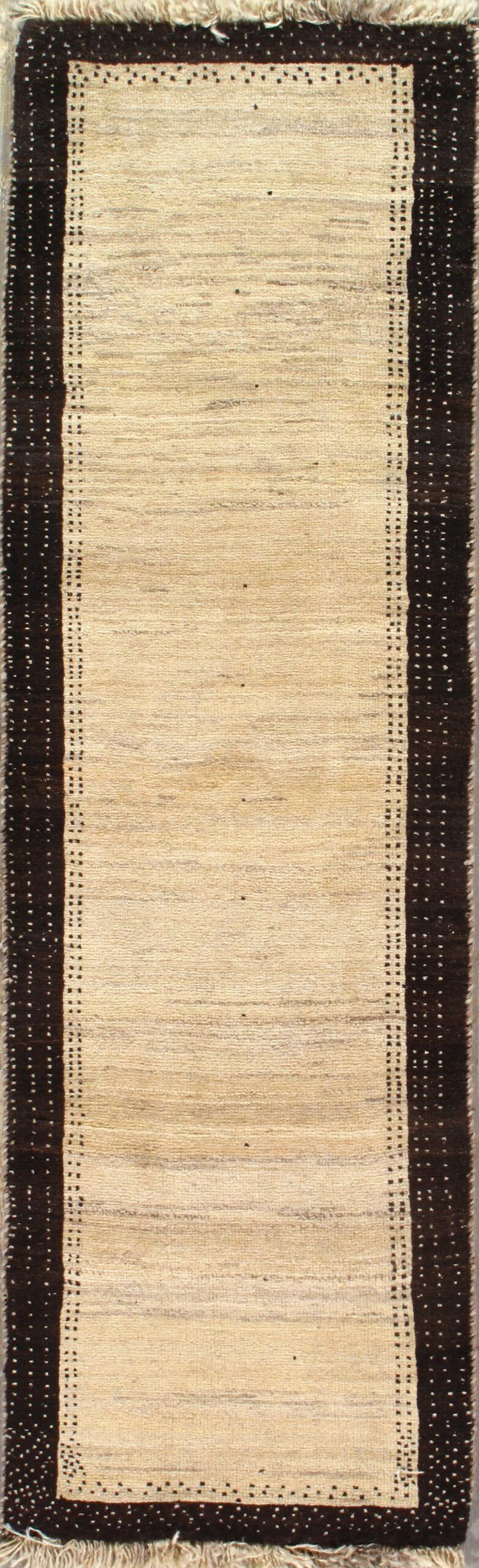 A rug with a black border is sitting on a table