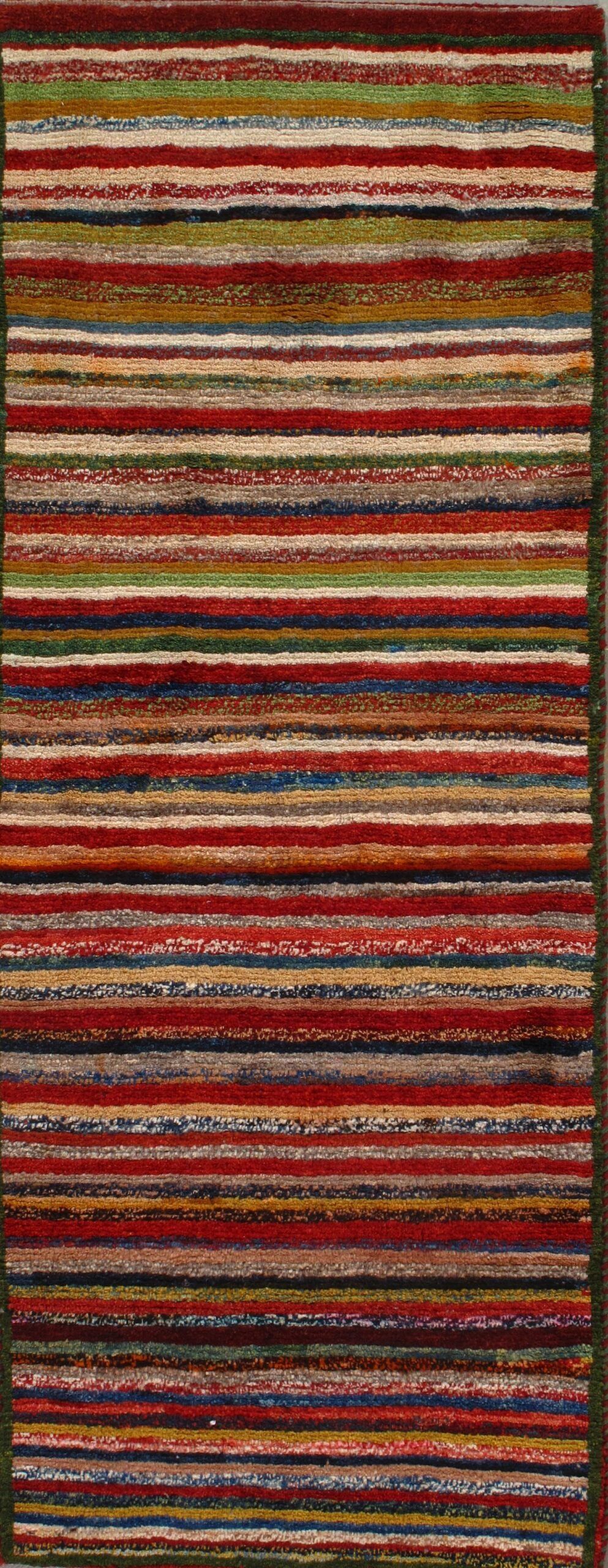 A close up of a colorful striped rug on a table.