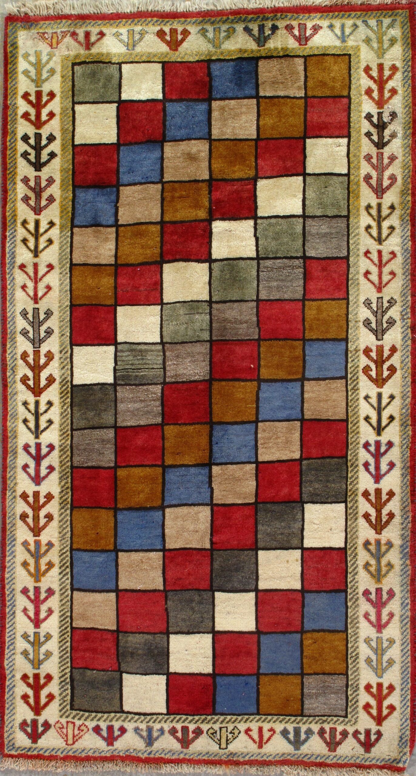 A colorful rug with squares and arrows on it