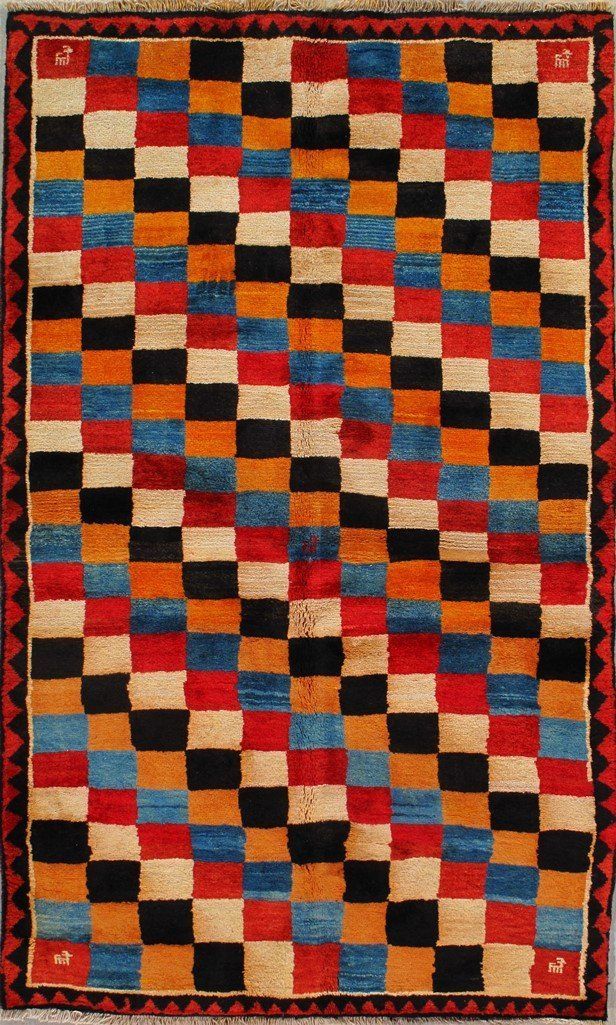 A colorful rug with a checkered pattern on it