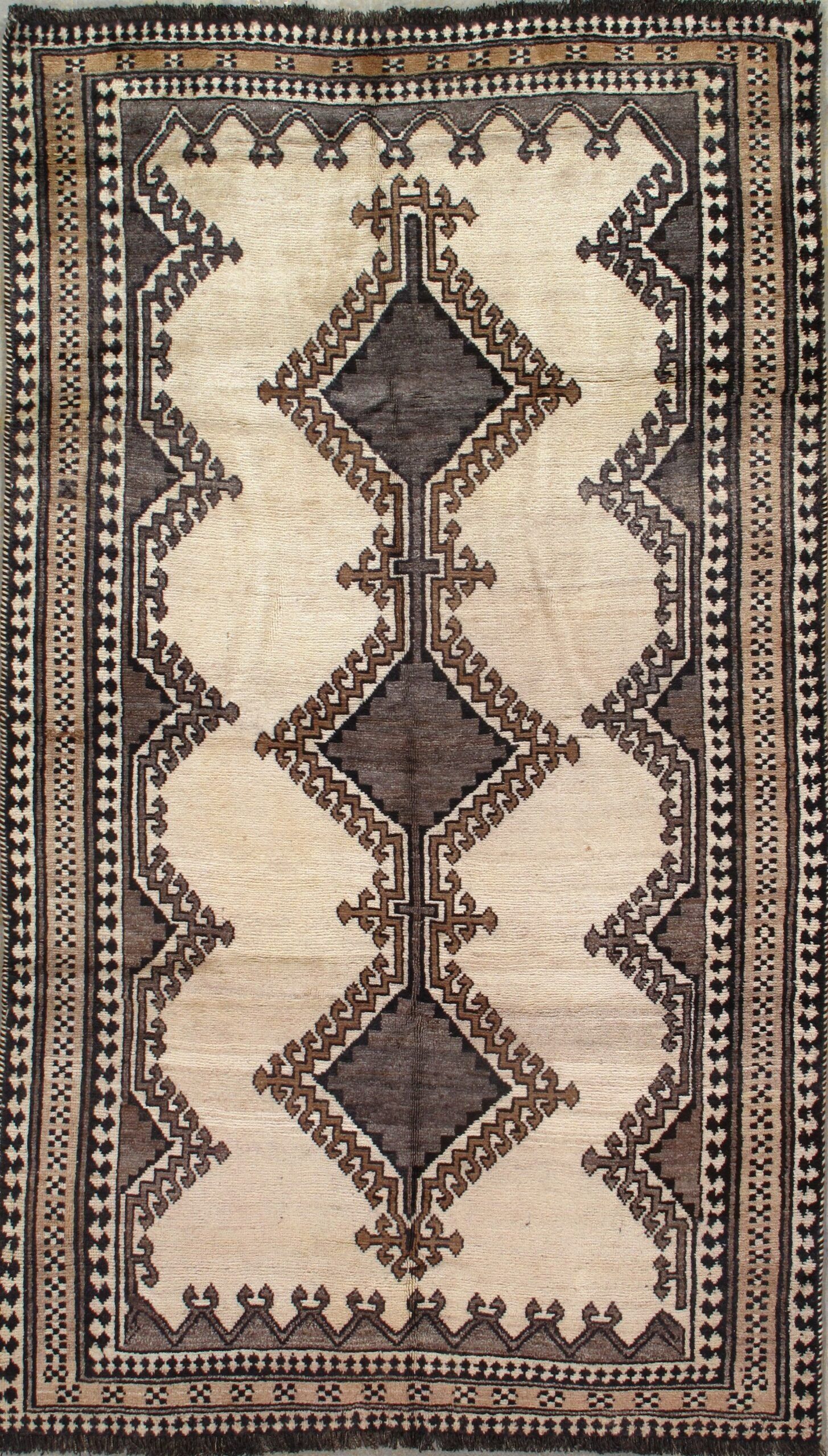 A rug with a geometric pattern on it is sitting on a table.