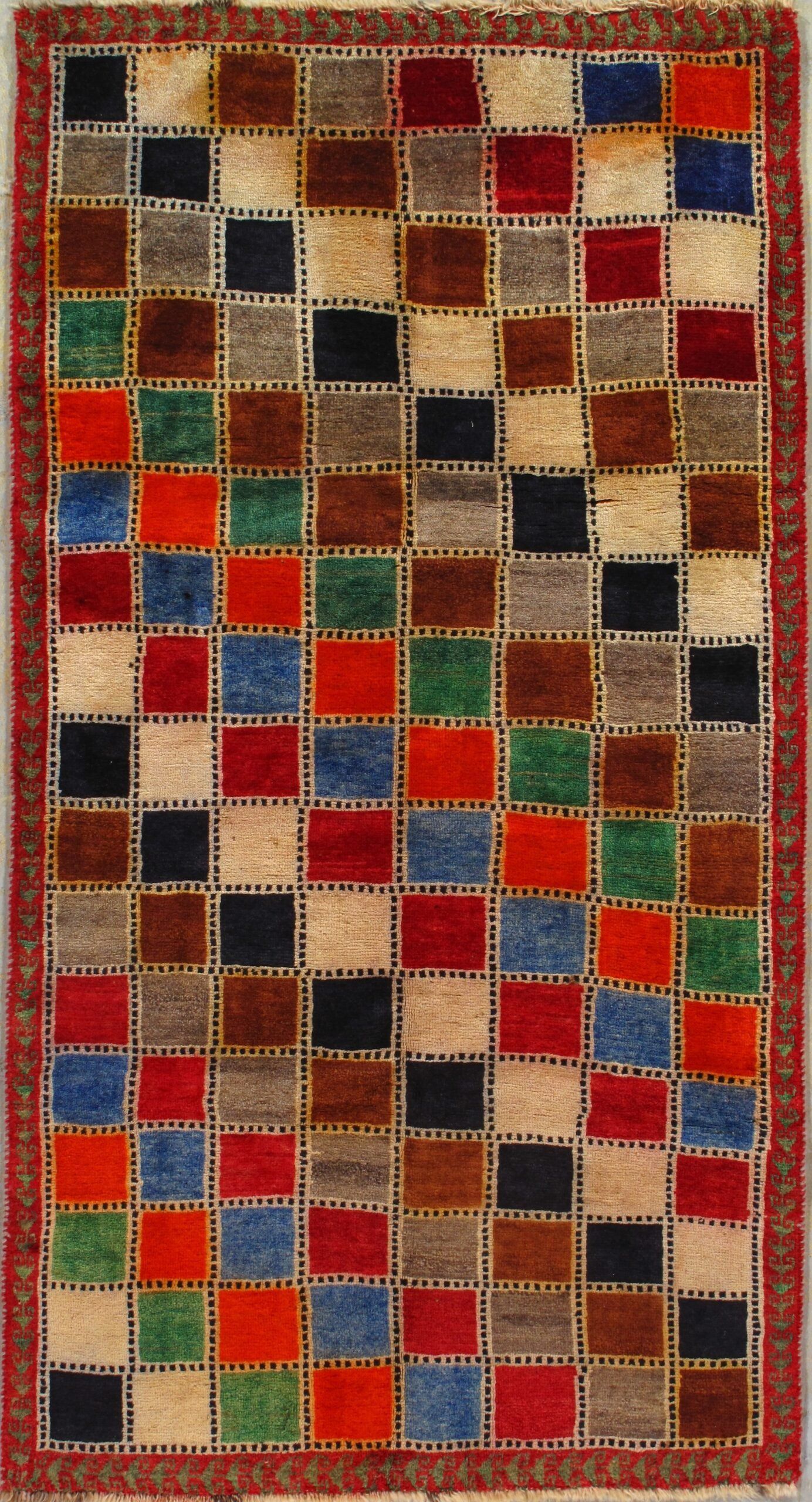 A colorful rug with squares of different colors on it