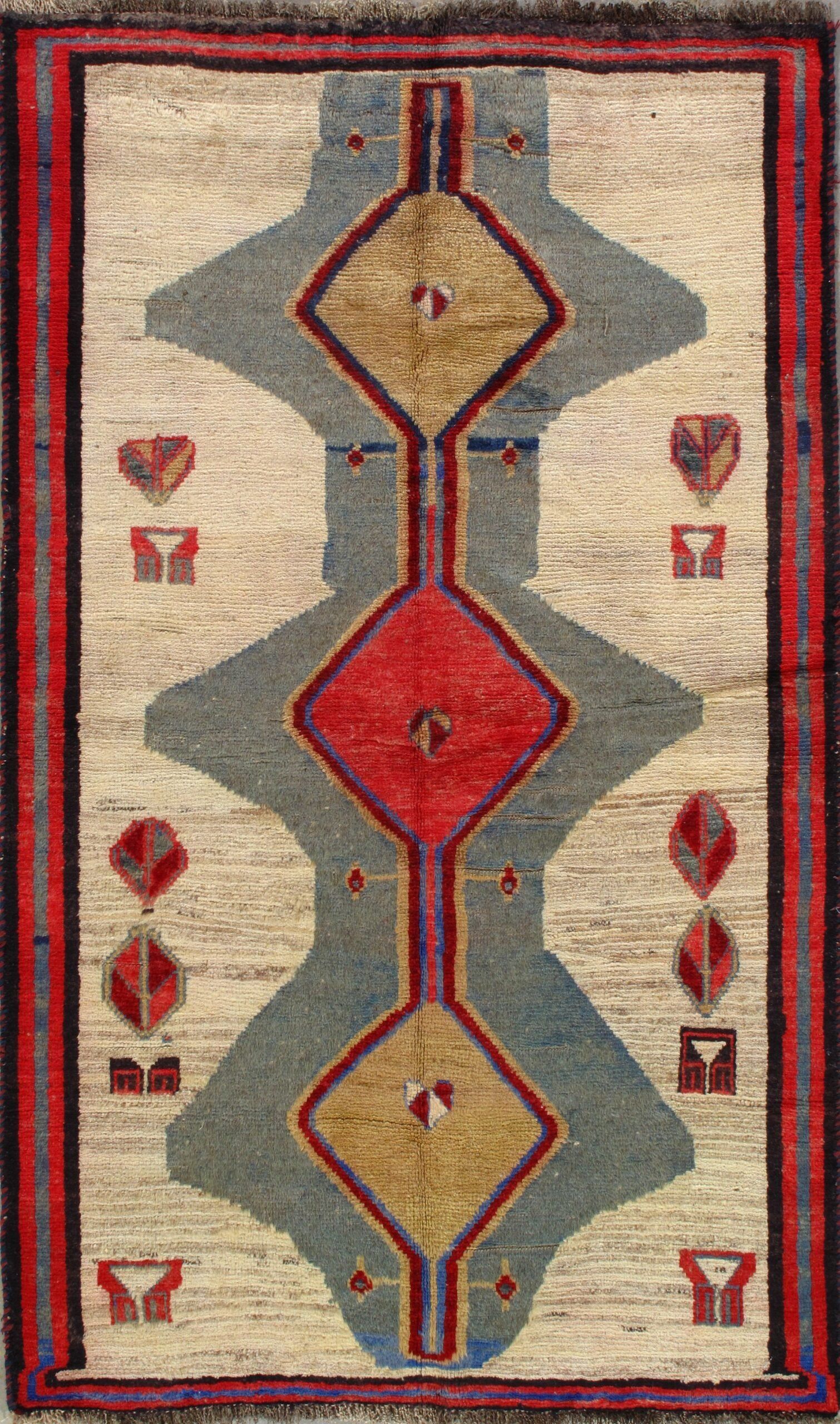 A rug with a red , yellow and blue pattern on it.