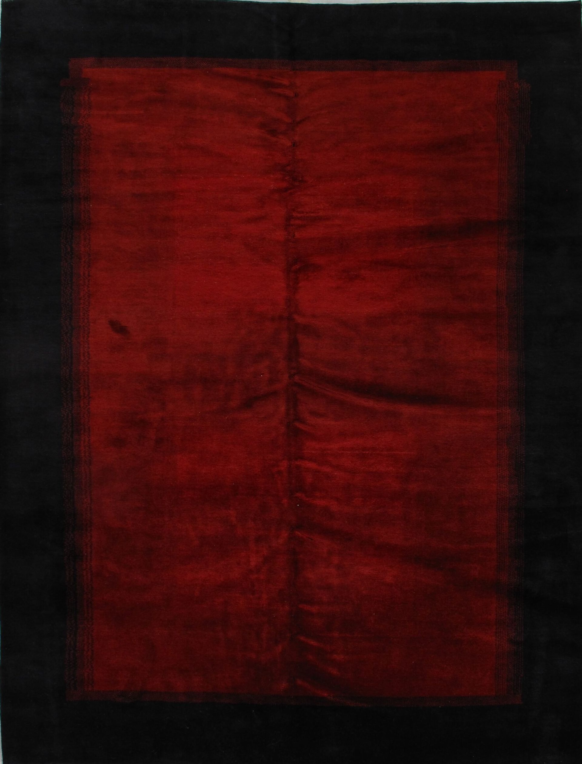 A red and black piece of fabric with a black border