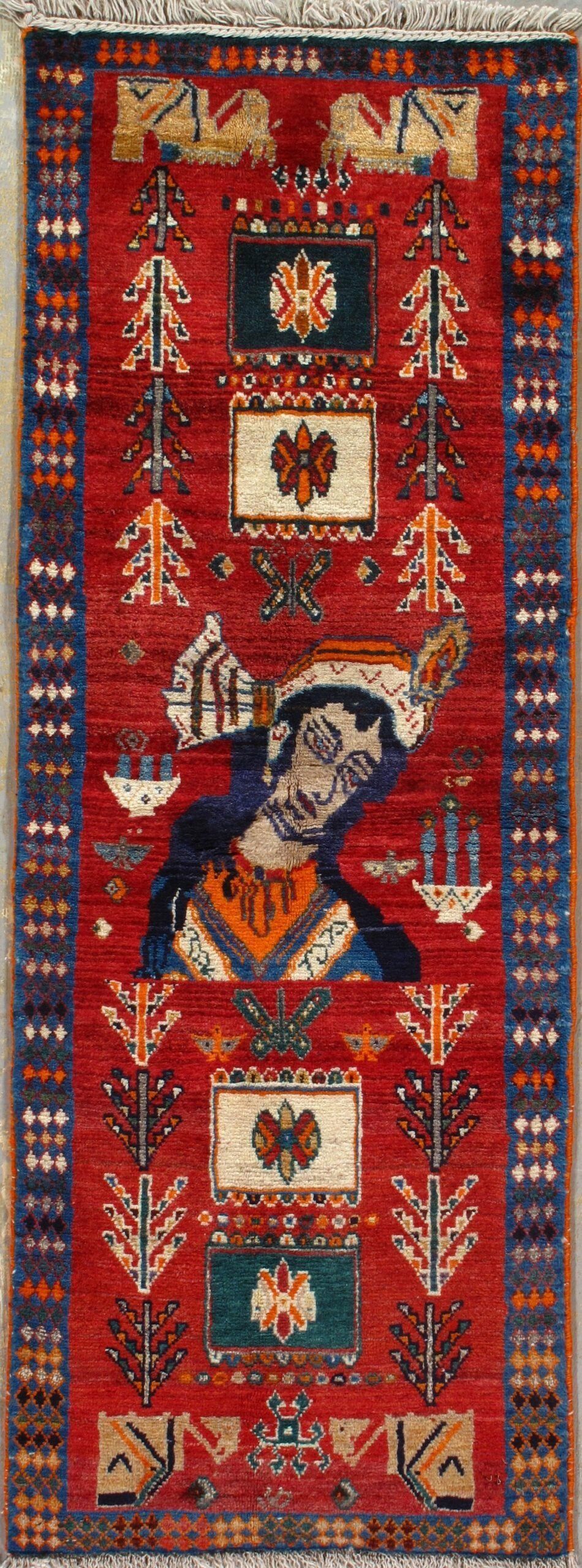 A red rug with a picture of a man on it.