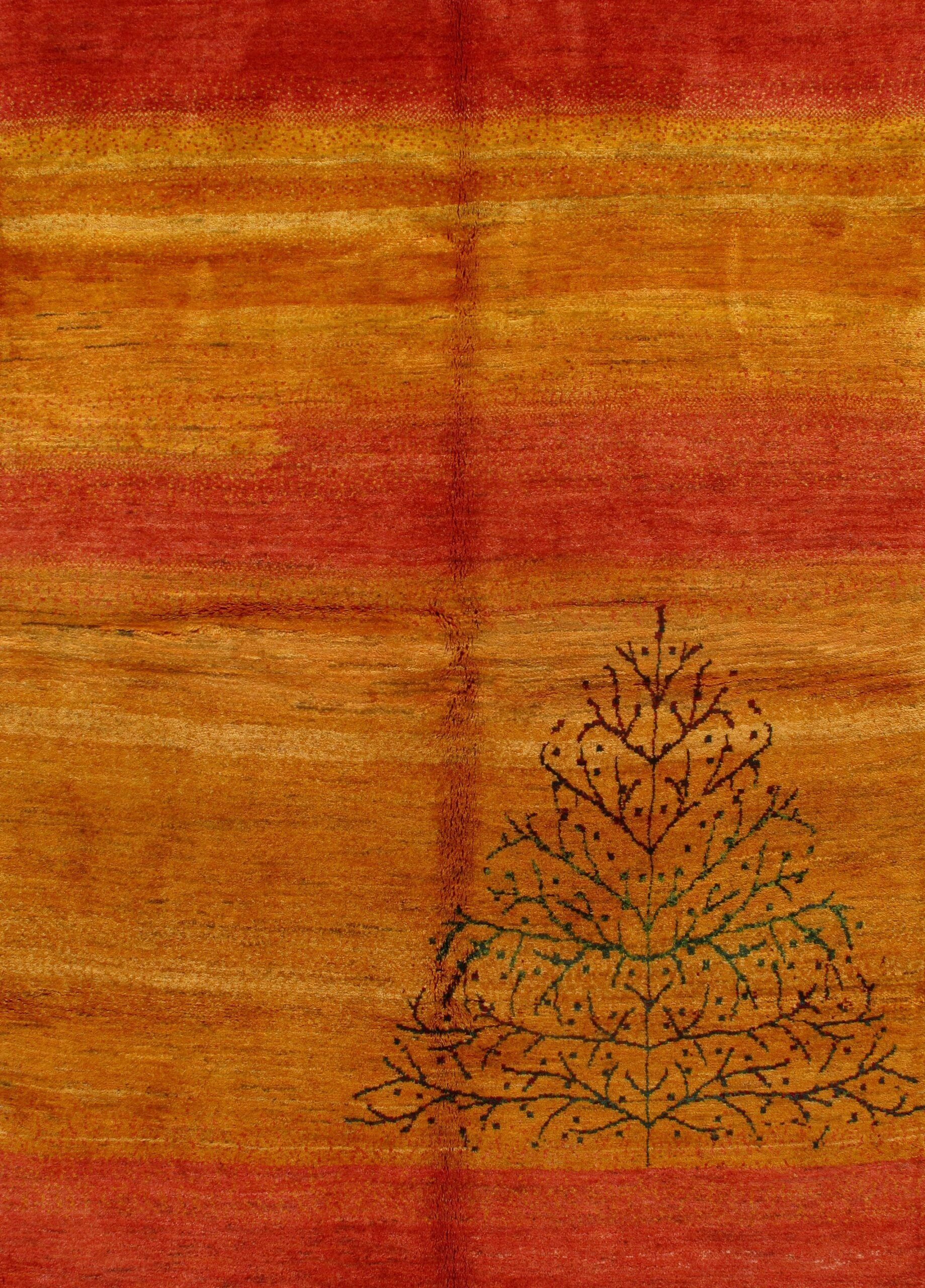 A close up of a rug with a tree on it.