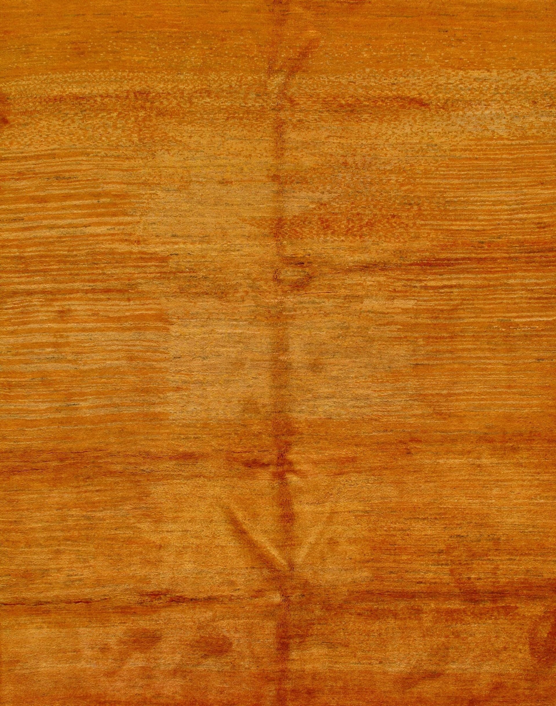 A close up of a piece of wood with a grainy texture.